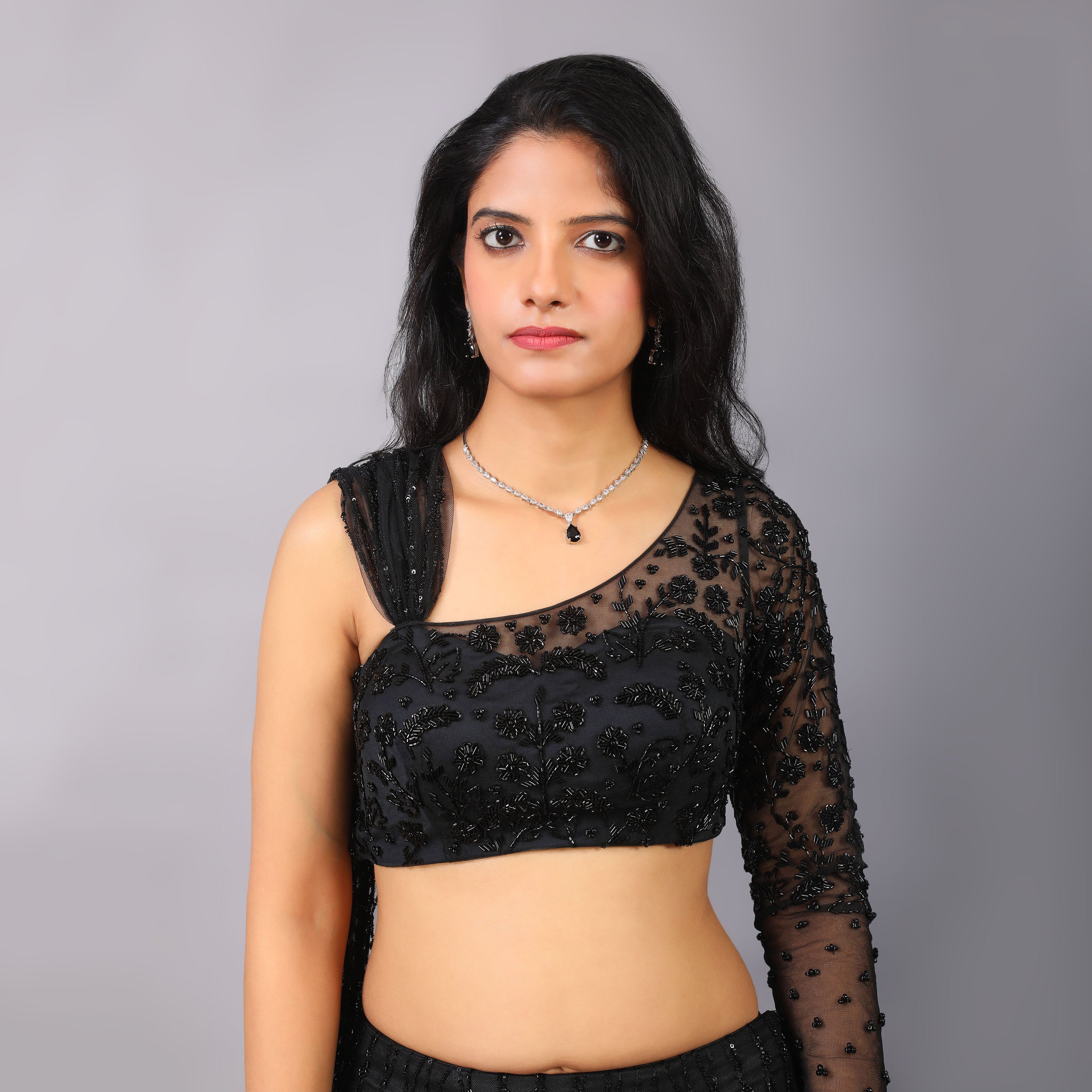 Black Fish-cut godet style flared hand emboridered lehenga with one sleeve hand embroidered blouse and dupatta attached with it. - qivii