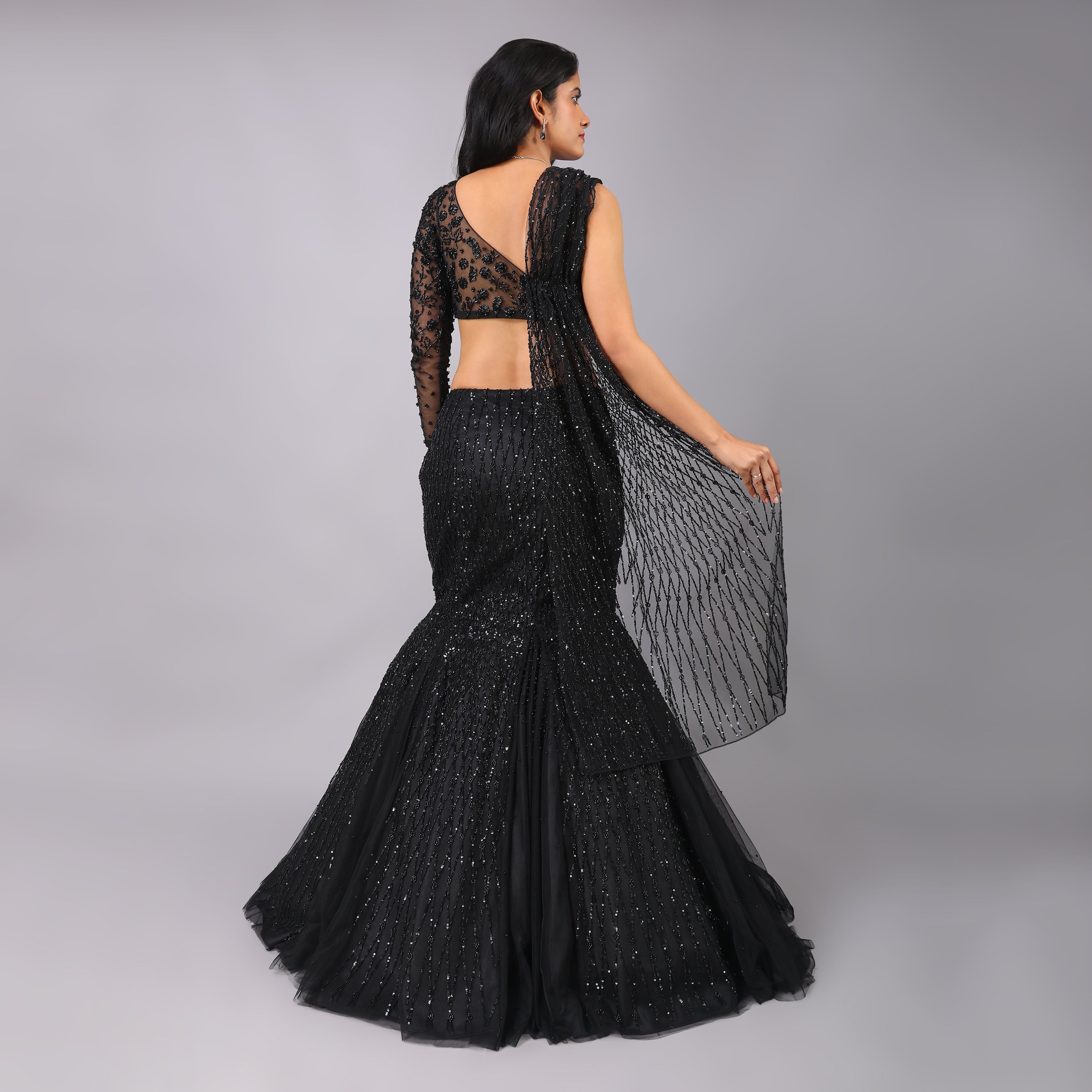 Black Fish-cut godet style flared hand emboridered lehenga with one sleeve hand embroidered blouse and dupatta attached with it. - qivii