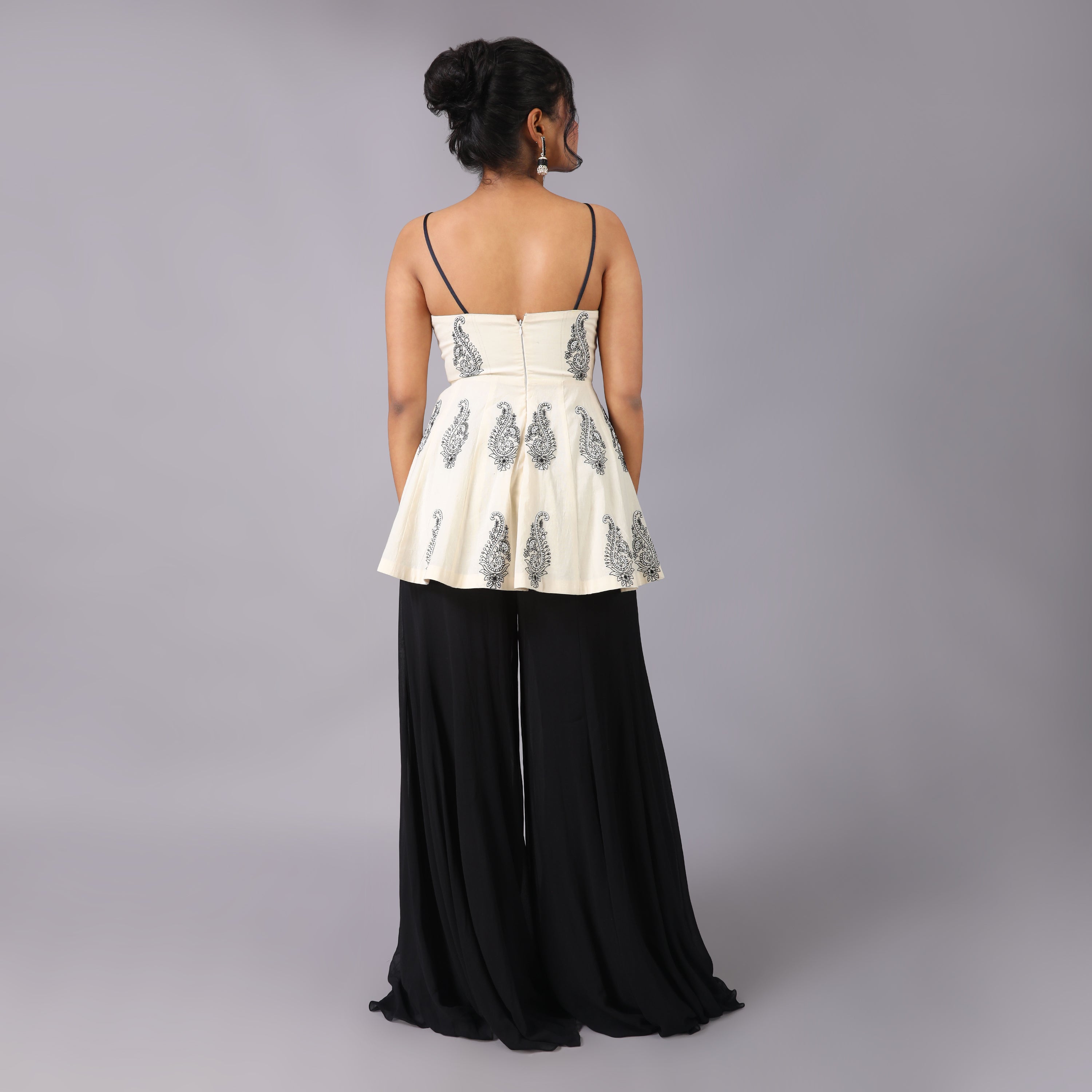 Elegant Ivory Peplum with black georget sharara and dupatta with hightlight of beads all over it. - qivii
