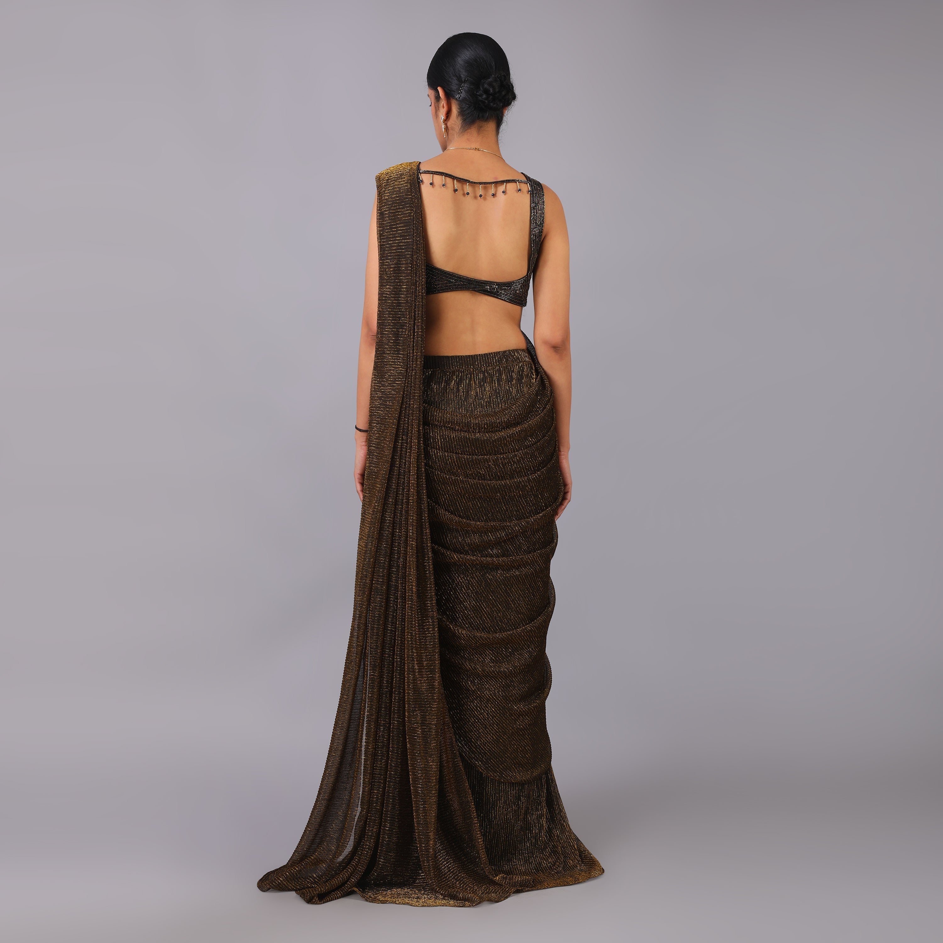 Shimmering Bronze Metallic Pre-draped Saree with geomatrical pattern hand embroidered blouse - qivii
