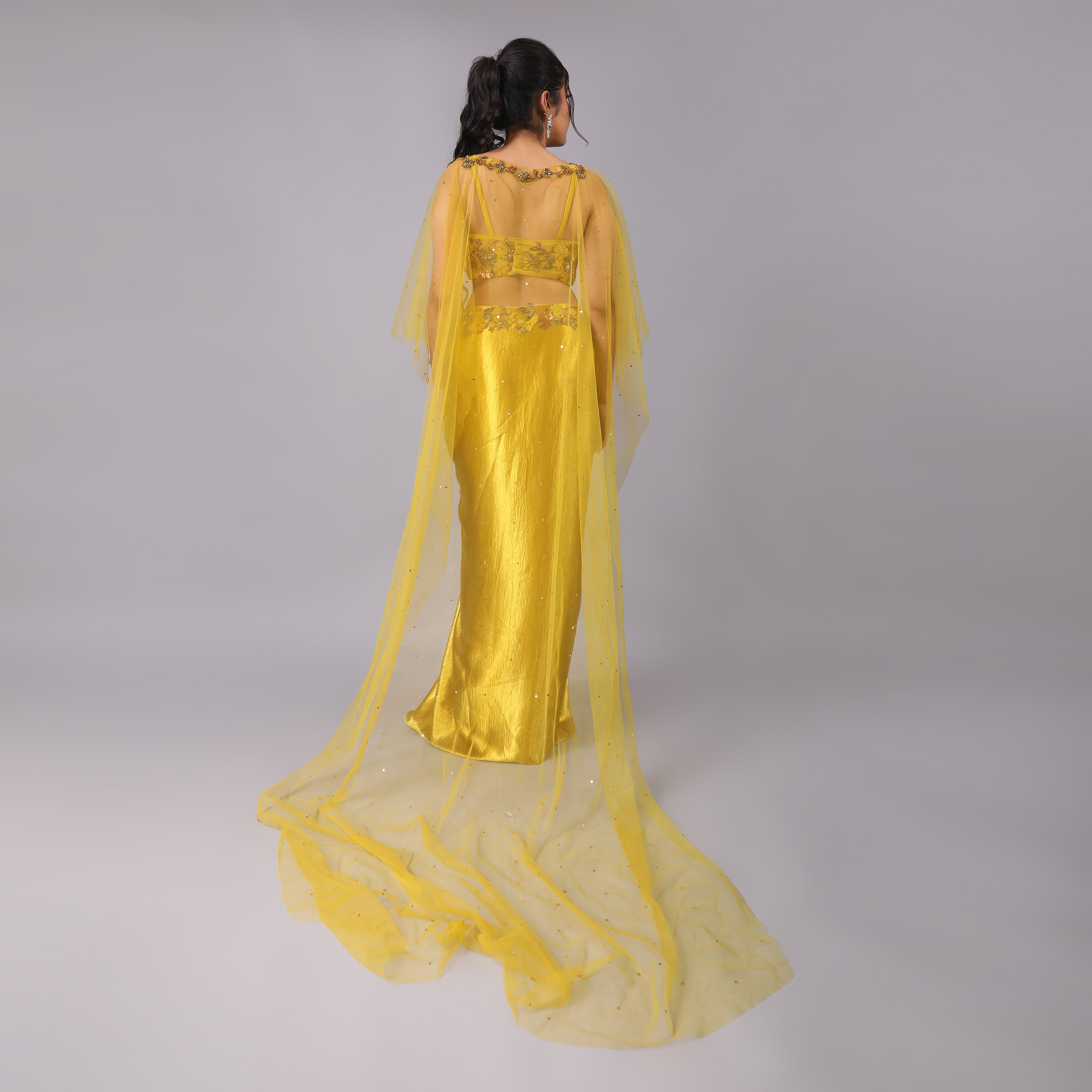 Golden Drape skirt and blouse with attached floral embellishments and Sheer trailed Cape adds glamour to this dress - qivii