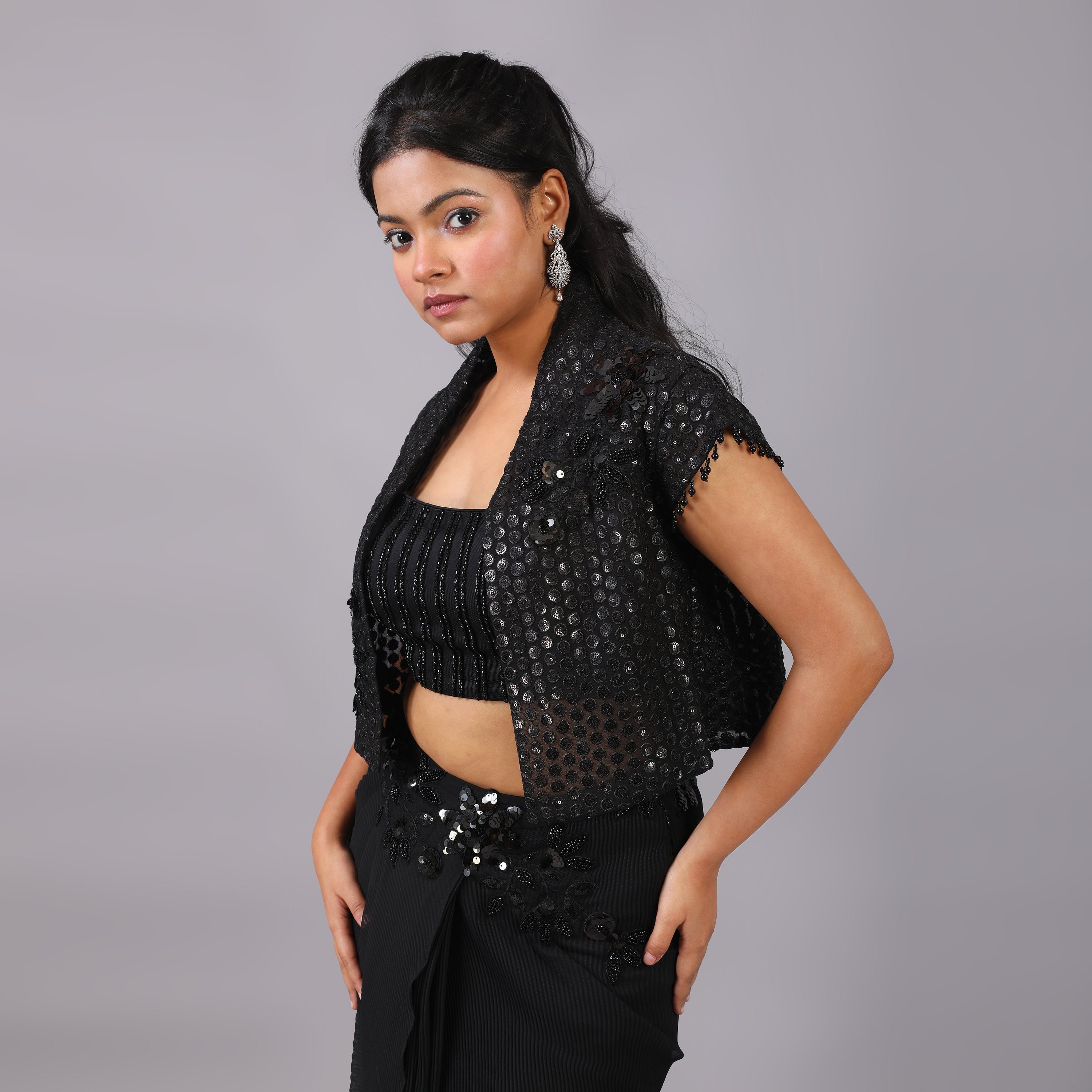 Pleated Drape skirt and blouse with attached floral embellishments enhance its look, its jacket has latkan on its sleeves. - qivii