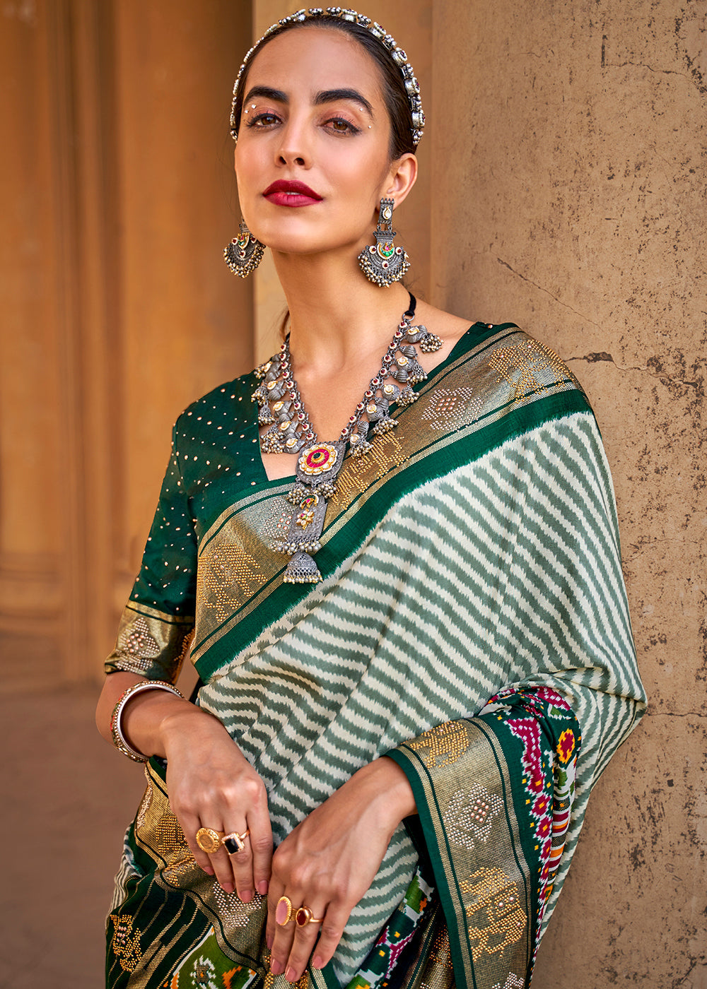 Dark Green Designer Patola Silk Saree with Zari Border & Stone work - qivii