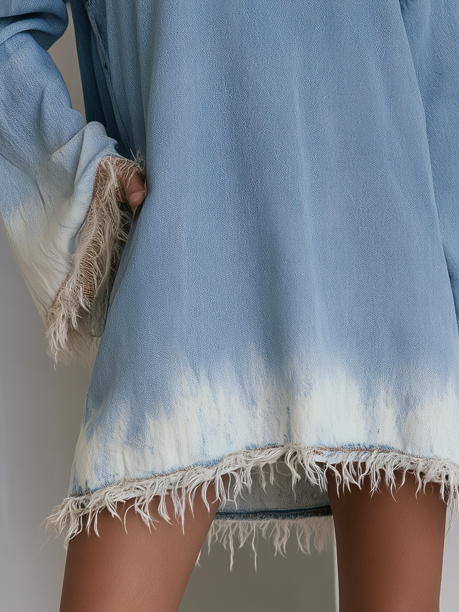 Oversized boho chic denim tunic dress with fringe hem and dip dye boat neck by Oyrosy Clothing, worn as women's casual clothing.