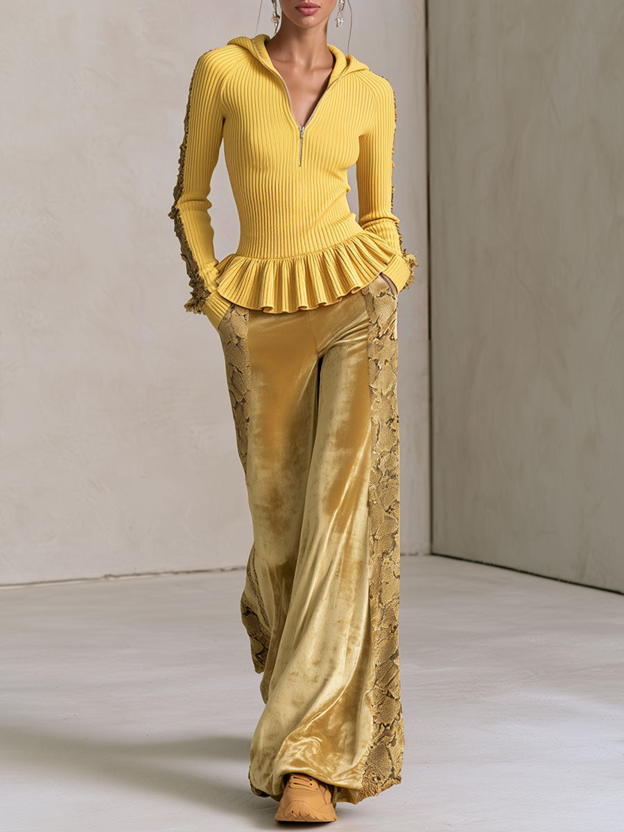 Yellow knitted hooded top with ruffles paired with snakeskin velvet pants, stylish women's clothing by Oyrosy Clothing.