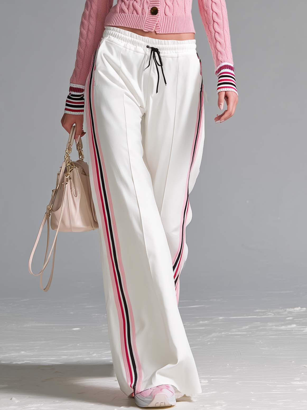 Retro sporty pink cable knit cardigan and wide-leg track pants set for women by Oyrosy Clothing, featuring side stripes and cozy knit fabric.