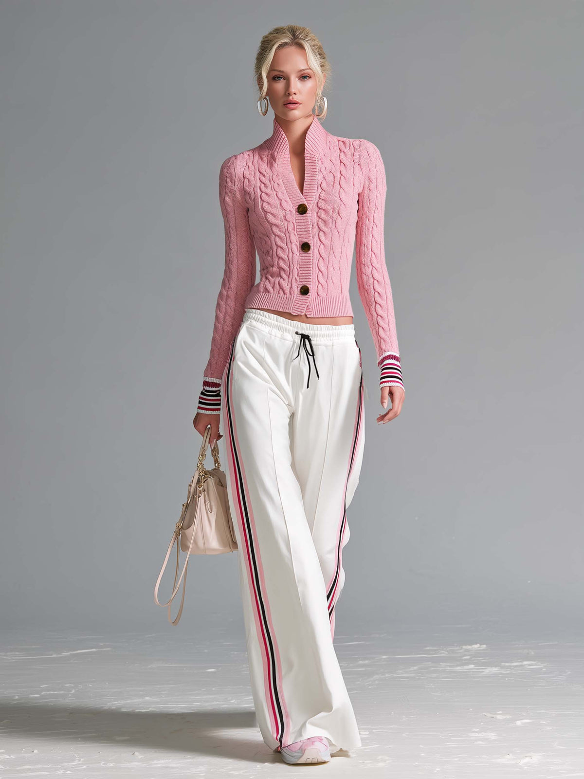 Retro sporty pink cable knit cardigan and side stripe wide-leg track pants set by Oyrosy Clothing, featuring a stylish women's clothing ensemble.