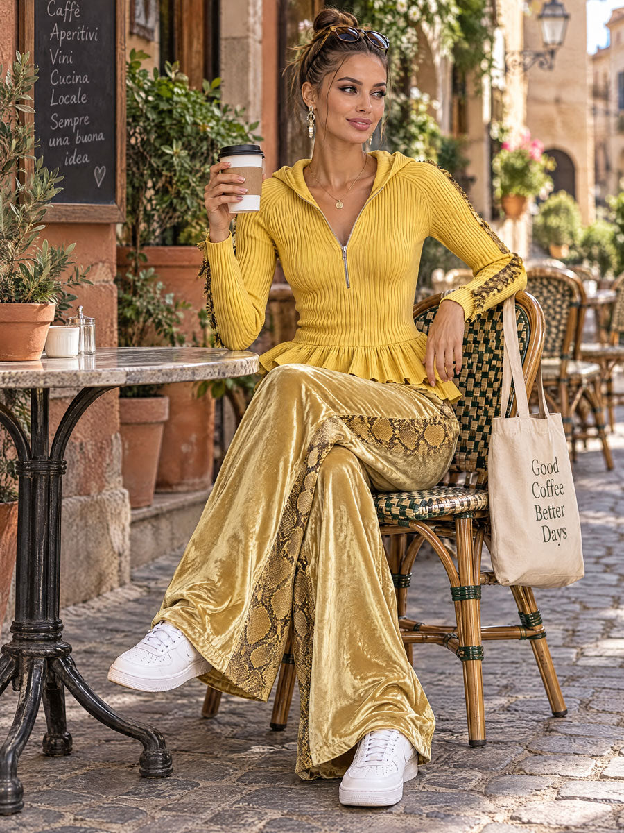 Women's yellow knitted hooded top with ruffles paired with snakeskin velvet pants from Oyrosy Clothing, stylish and comfortable.