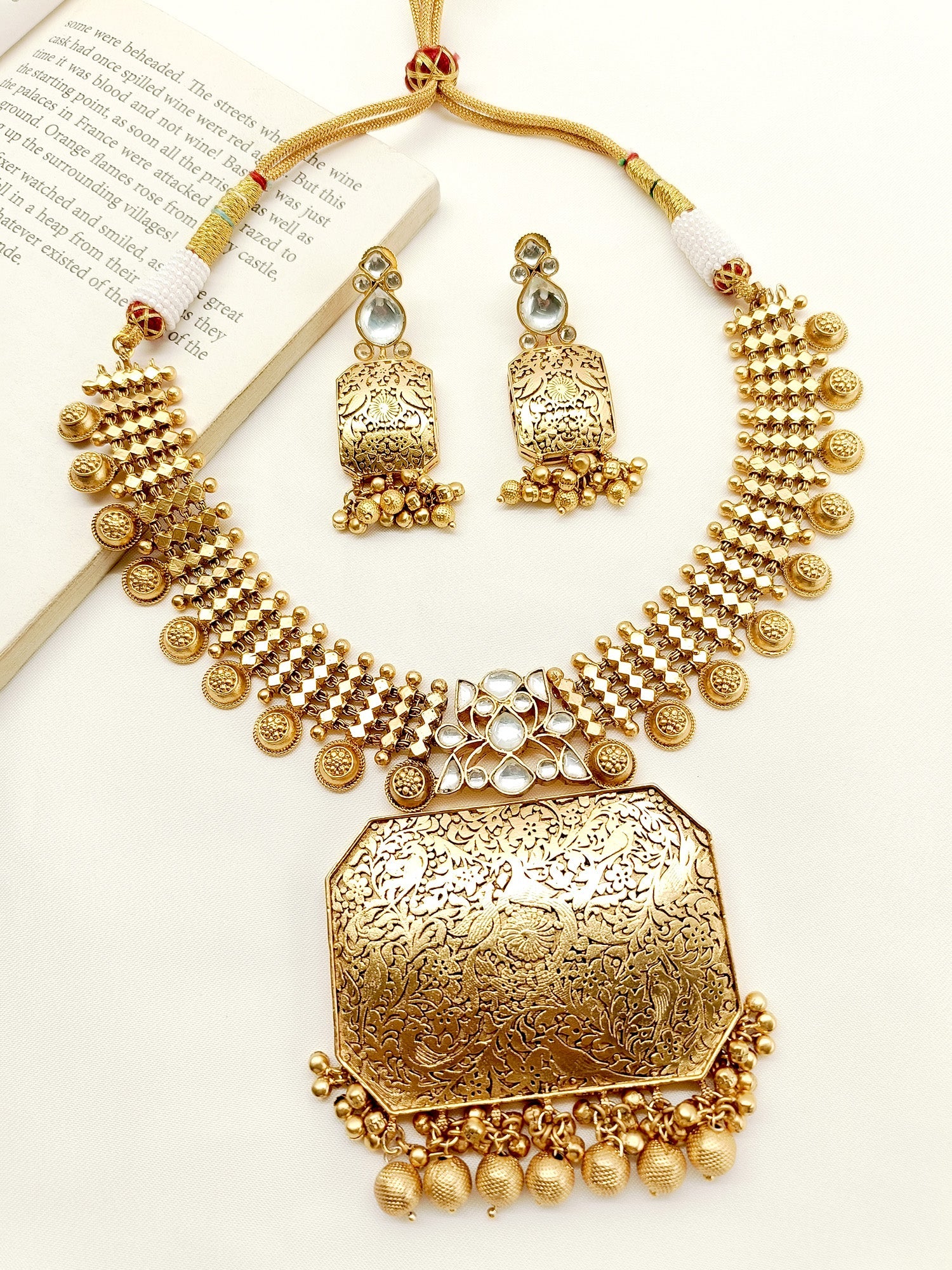 Yukti Plain Antique Necklace Set crafted with antique gold plated brass metal