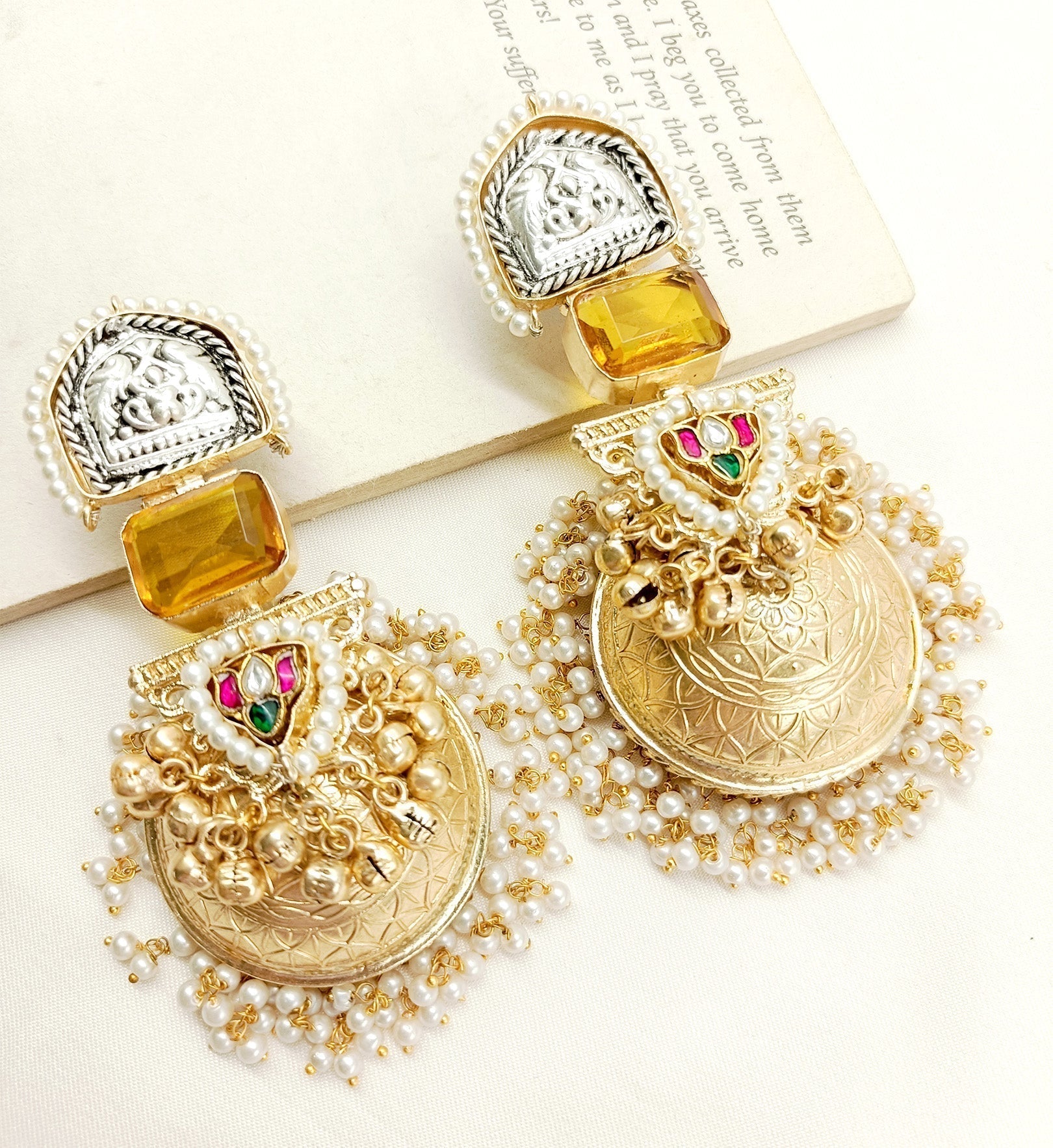 Gold plated brass metal jhumkis with kundan stones and pearl hanging
