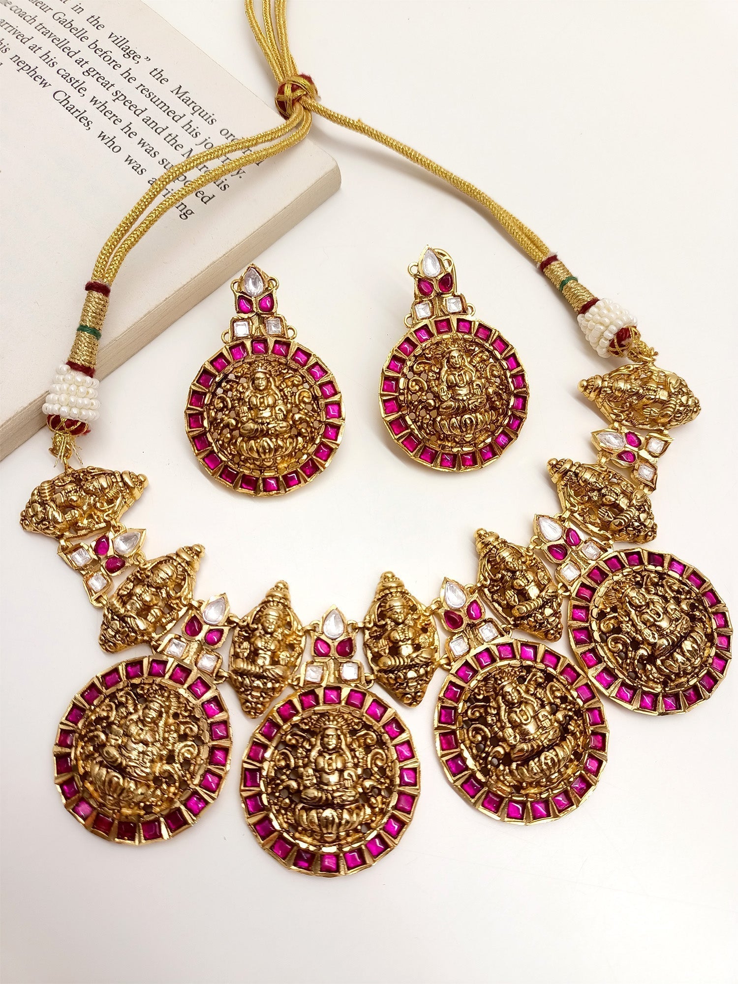 Seerat Majenta Antique Temple Necklace Set made of gold plated brass metal with beautiful temple motifs