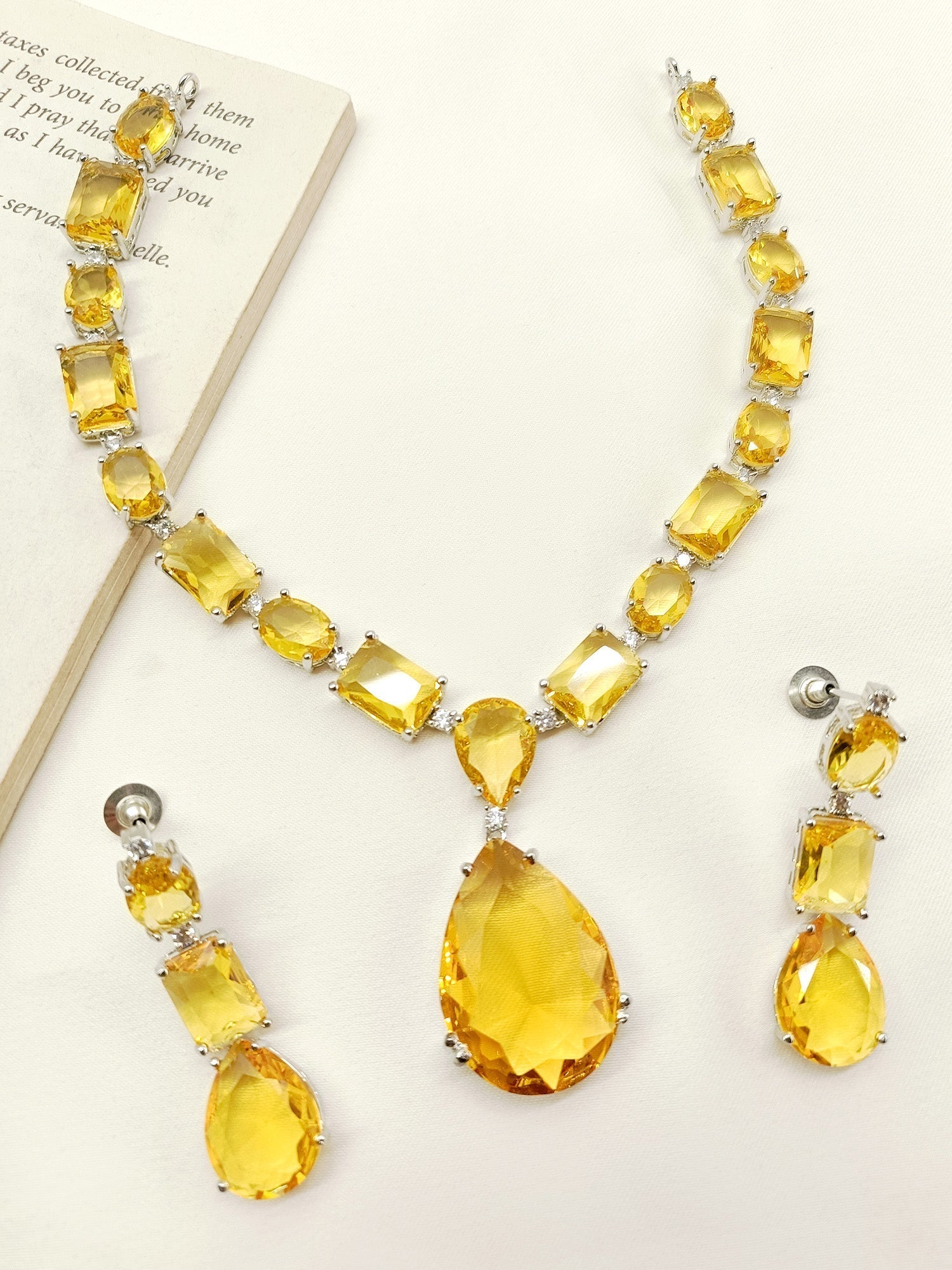 Swarovski stone necklace set with yellow stones on silver metal