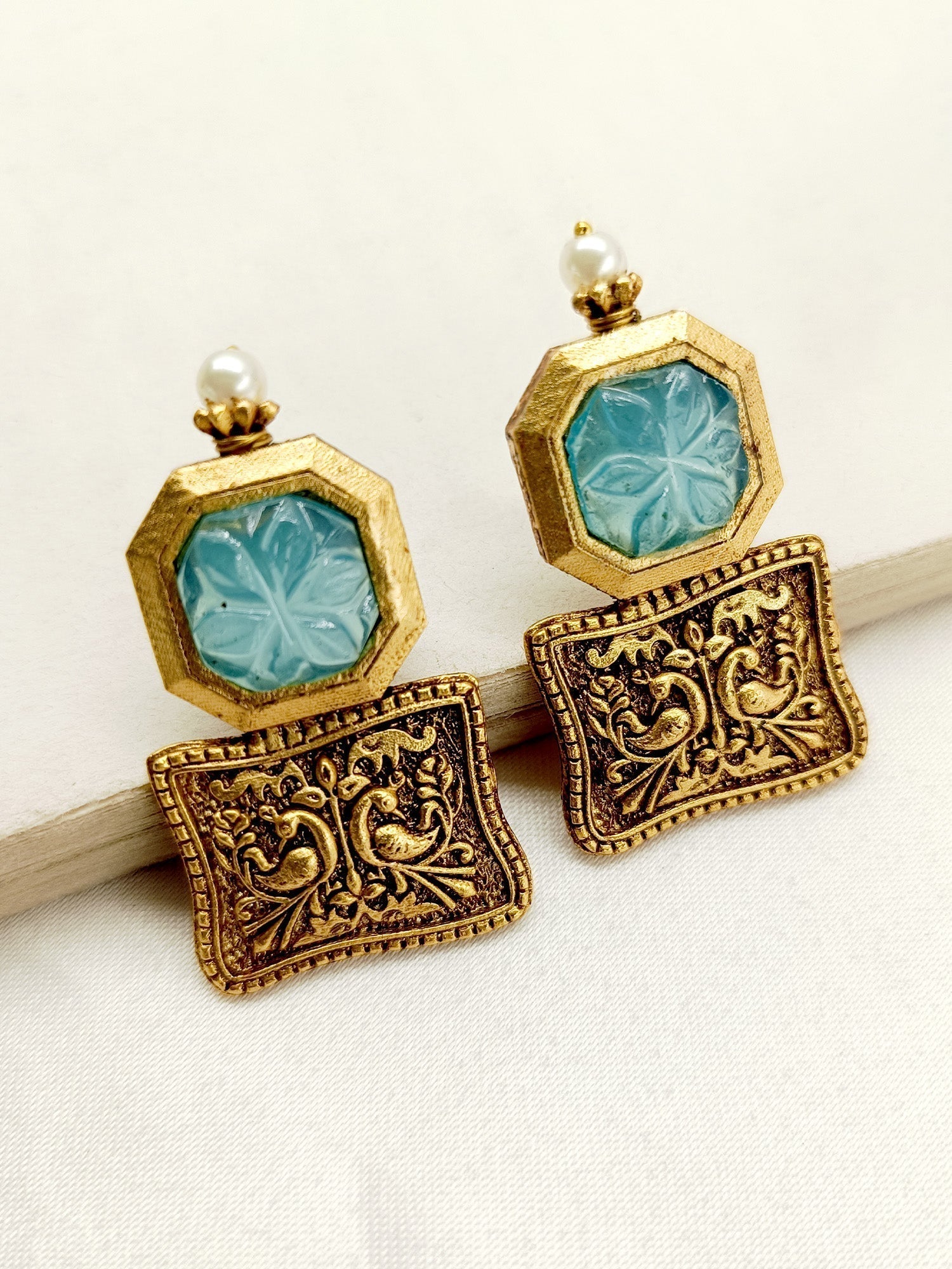 Close-up of Riya Sky Blue Boutique Earrings with intricate pearl detailing