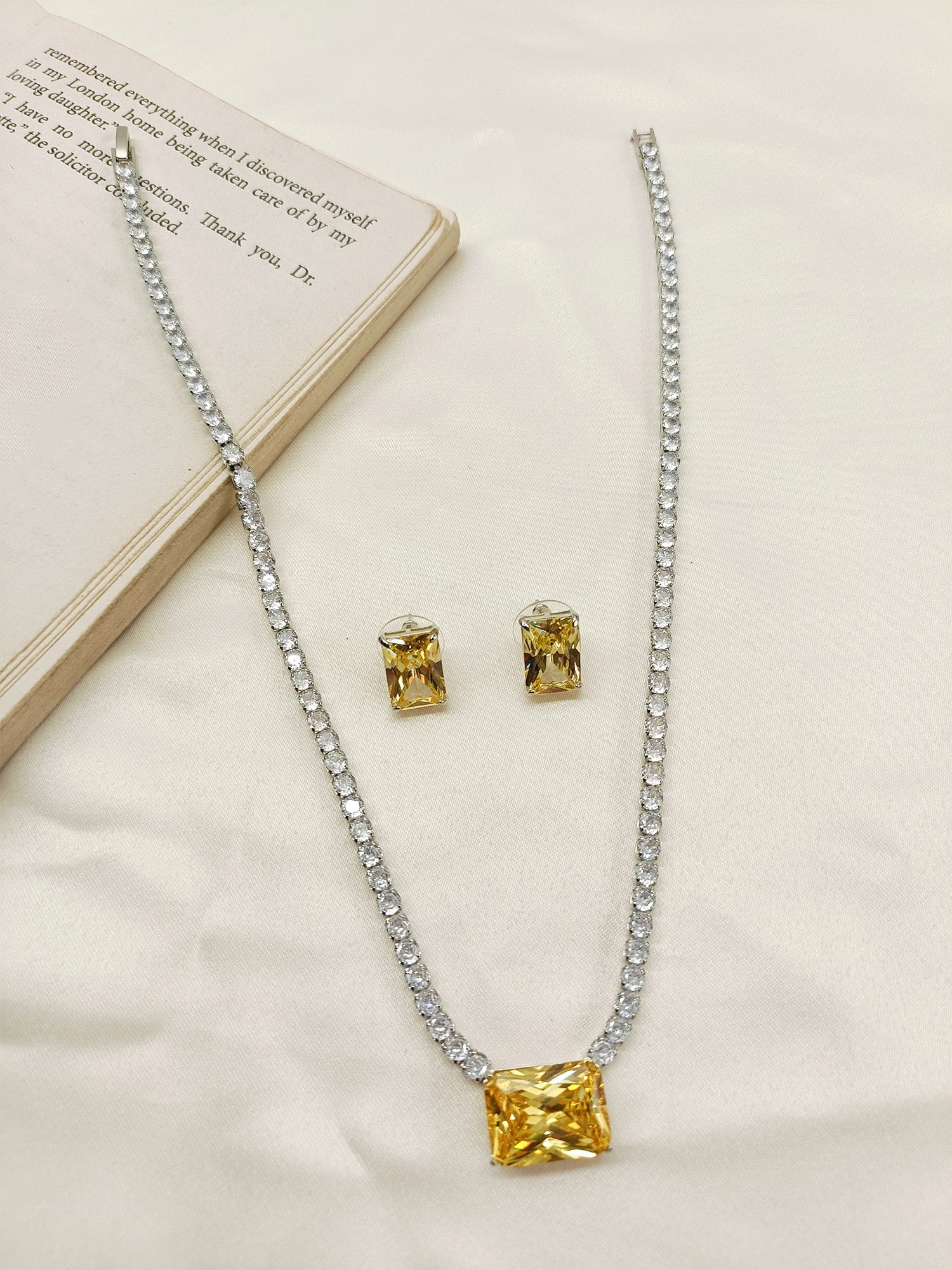 Close-up of Erin Yellow American Diamond Necklace Set with Silver Plated Brass Metal Chain and Sparkling American Diamonds