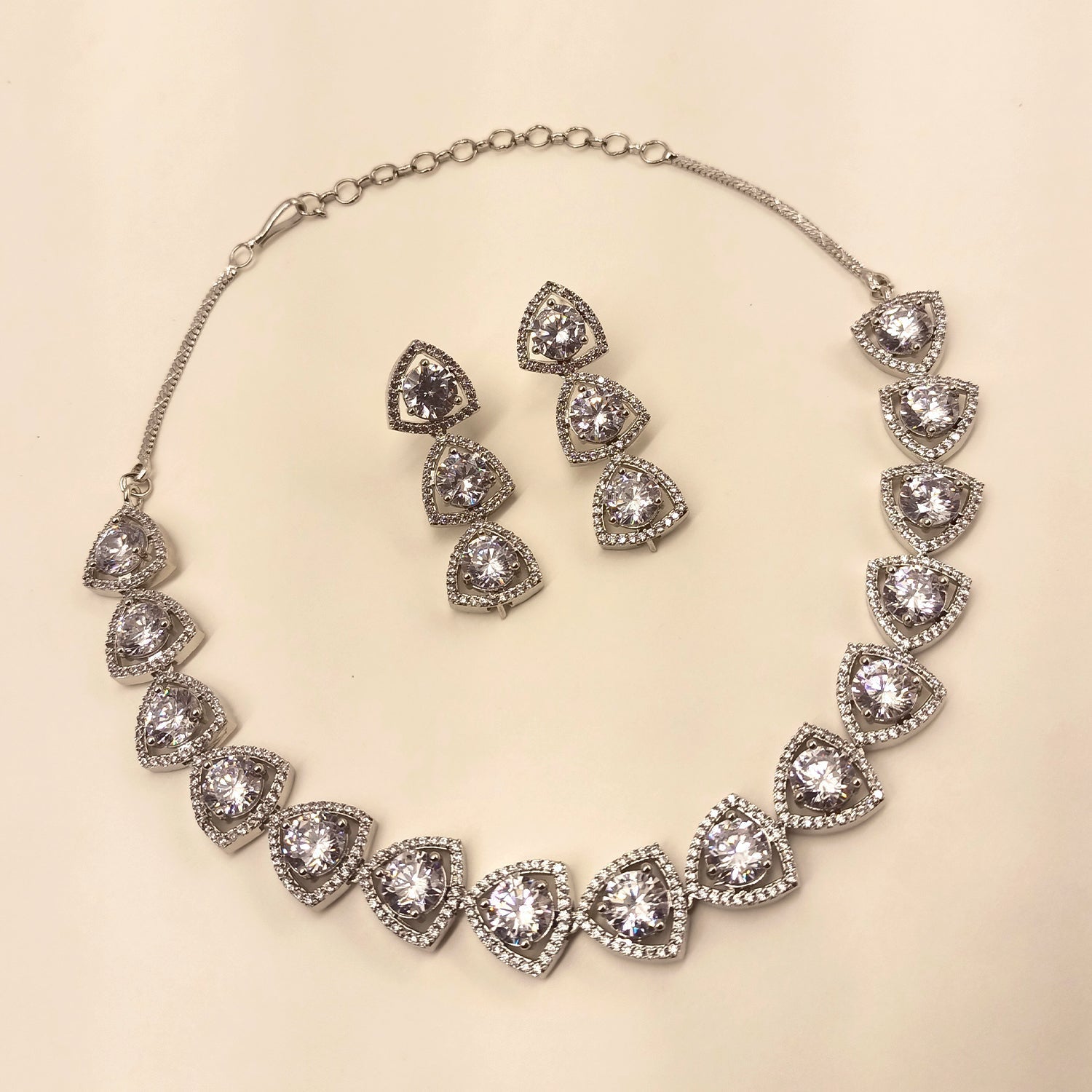 Exquisite Zaara Silver Plated Semiprecious White Stone American Diamond set with detailed silver plating and dazzling American Diamond embellishments