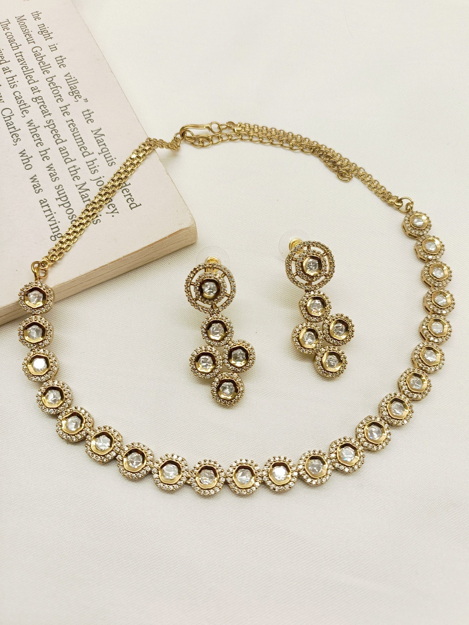 Anahita White Polki Necklace Set crafted from antique gold plated brass metal