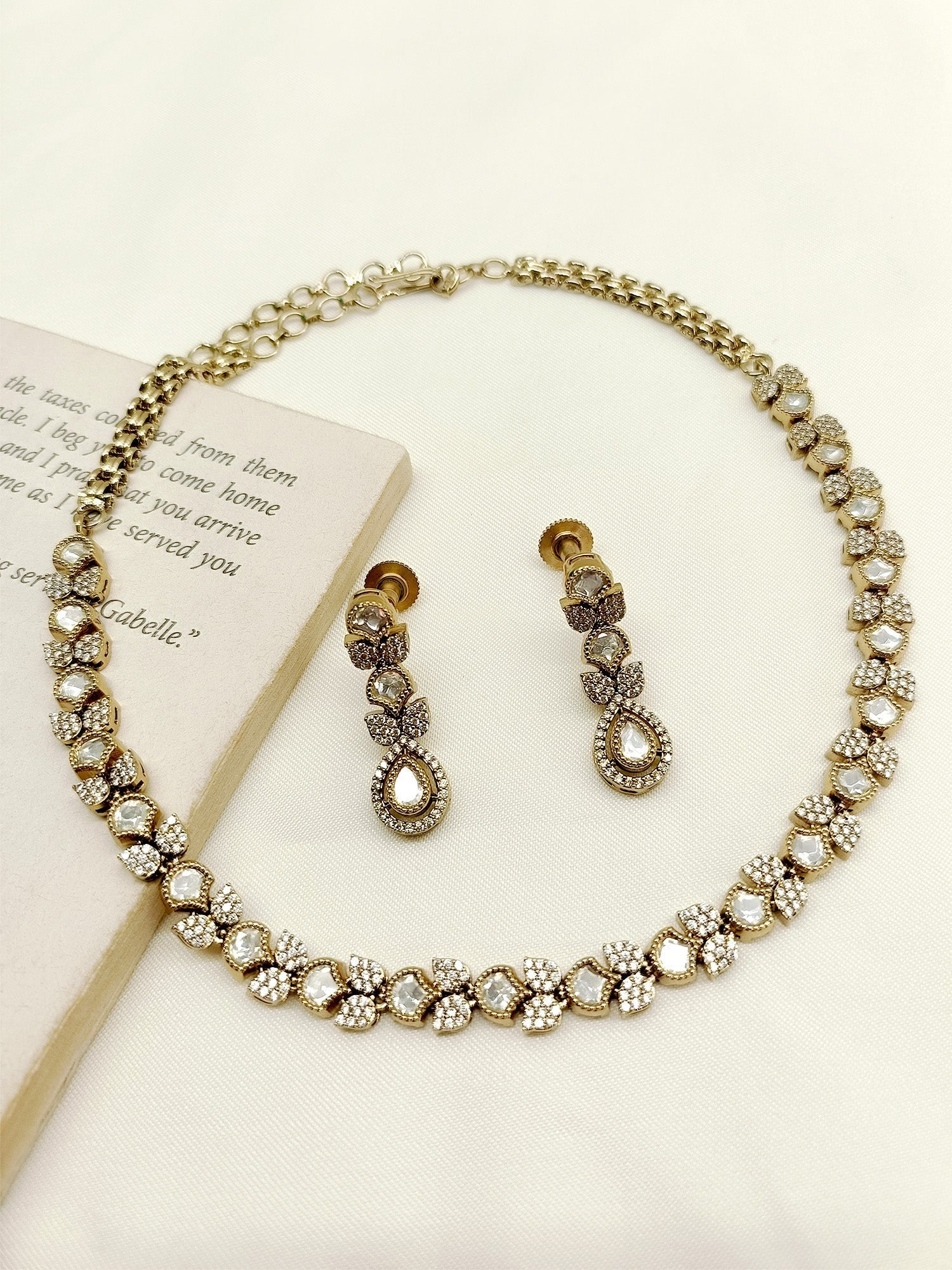 Close up of Ishmeen White Polki Necklace Set with Antique Gold Plated Brass Metal