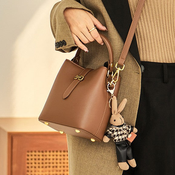 Women’s Bunny Charm Bucket Satchel — Cowhide Leather Convertible with Sculptural Clasp & Signature Whimsy