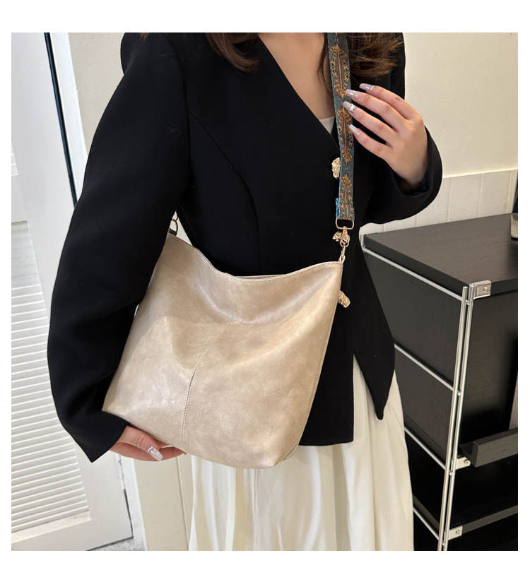 Women's Convertible Crossbody Bucket — Monochrome PU Carryall with Artisan-Embroidered Strap