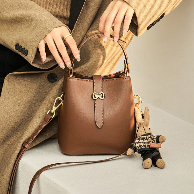 Women’s Bunny Charm Bucket Satchel — Cowhide Leather Convertible with Sculptural Clasp & Signature Whimsy