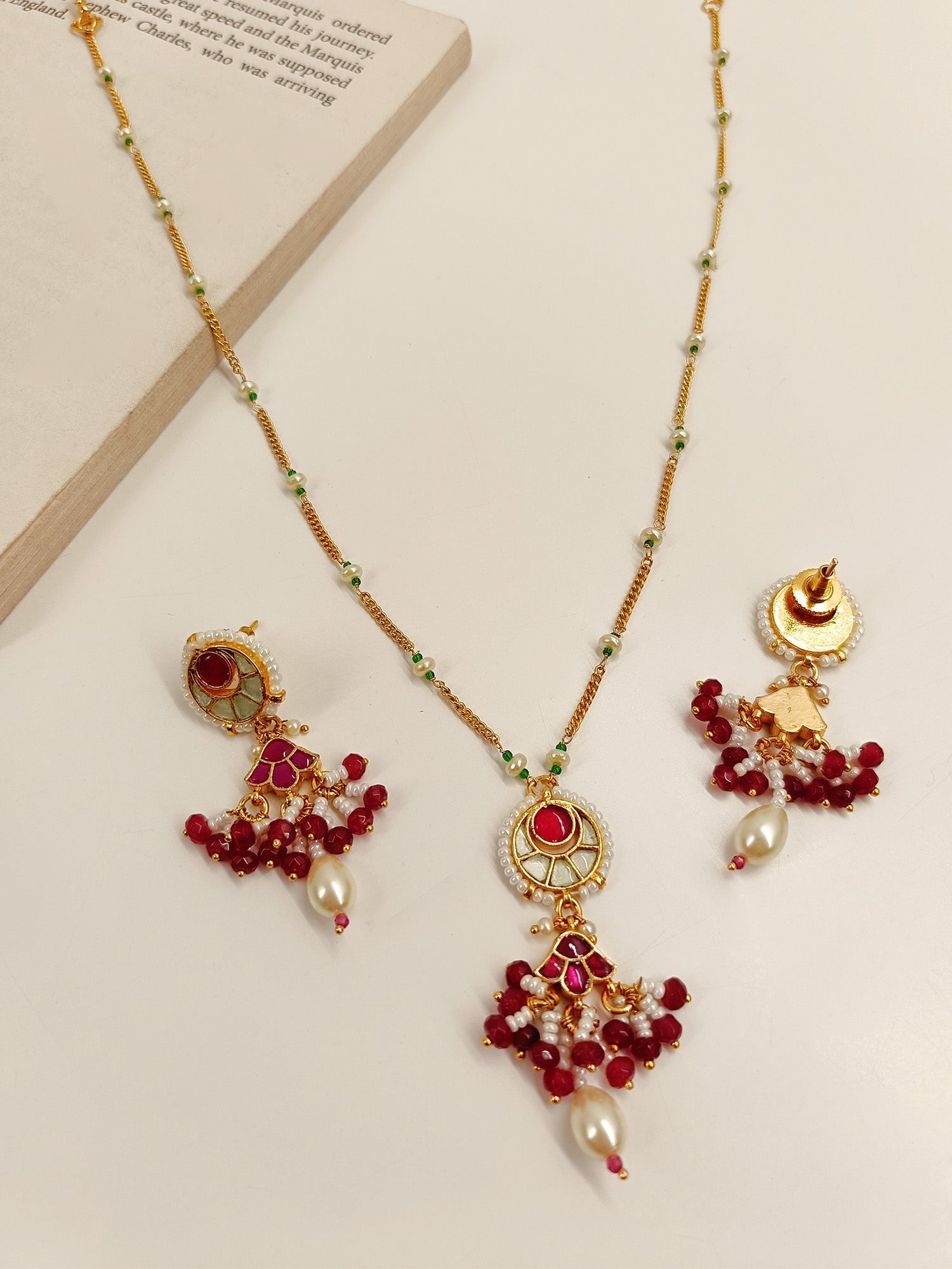 Elegant Traditional Kundan Pendant Set with detailed craftsmanship and gold plated brass metal, perfect for elevating any outfit