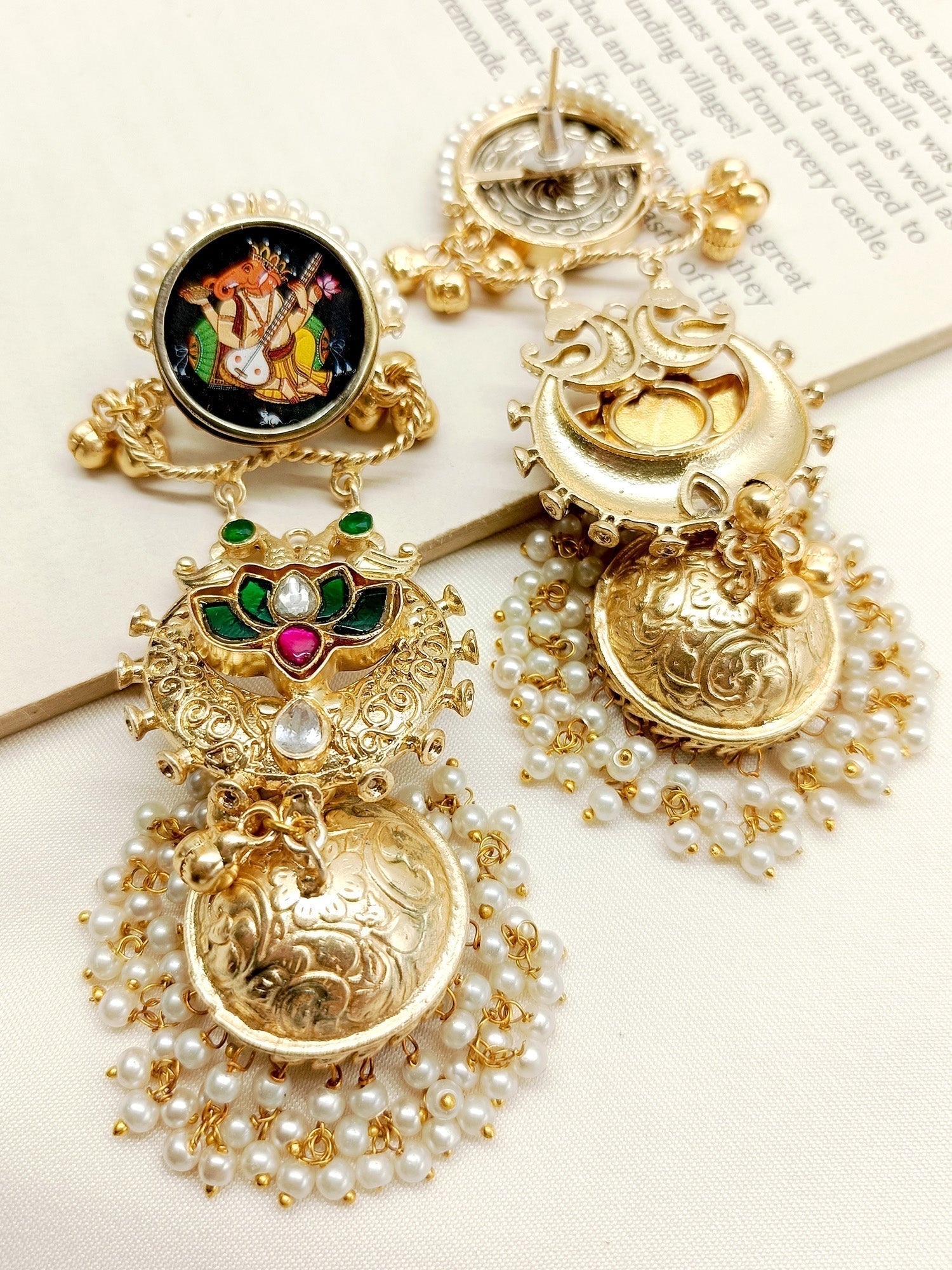 Gold and silver traditional Indian jhumki earrings from Kanika M & G Boutique