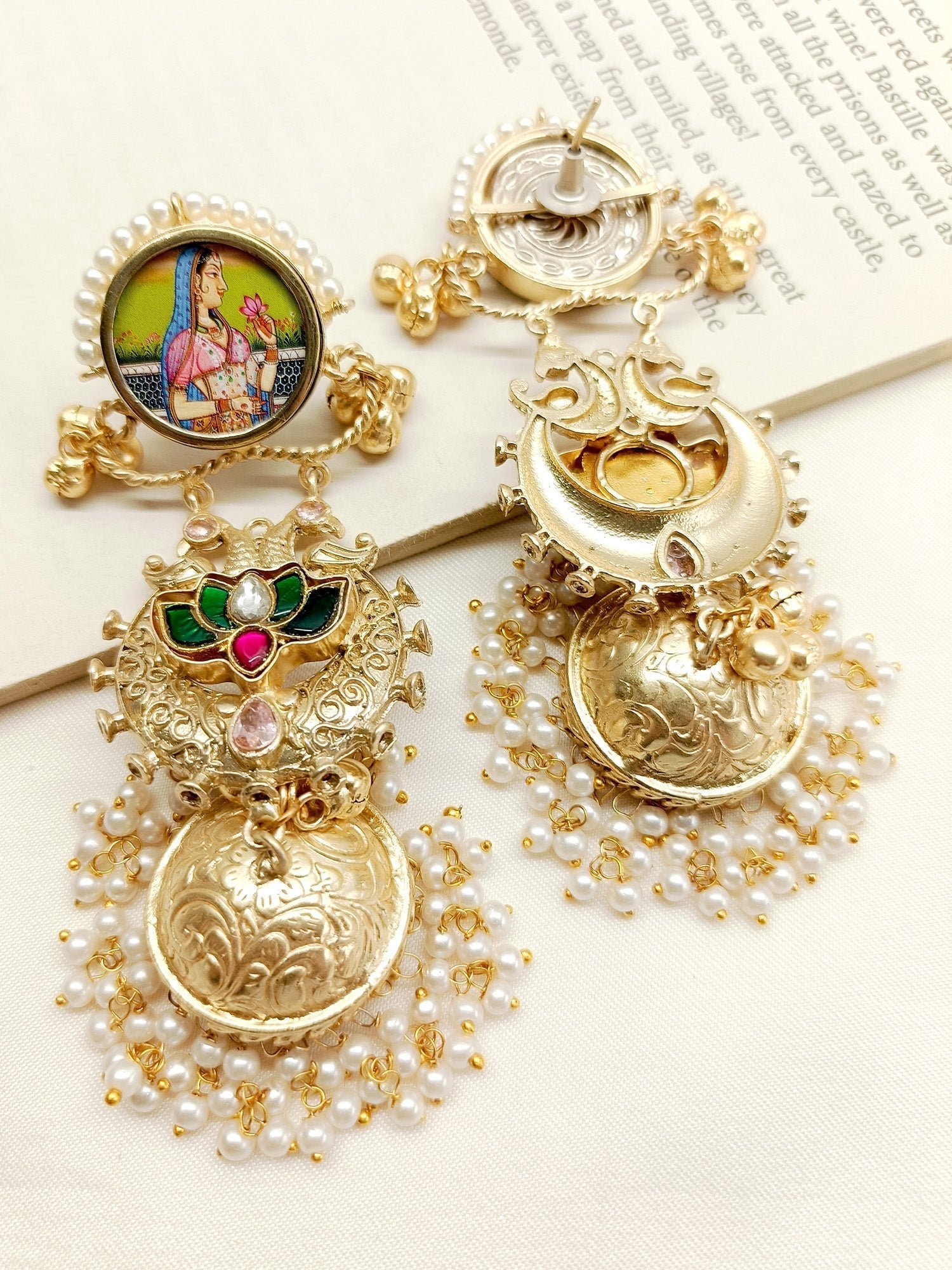 Elegant and traditional jhumki earrings with modern style and delicate pearl details