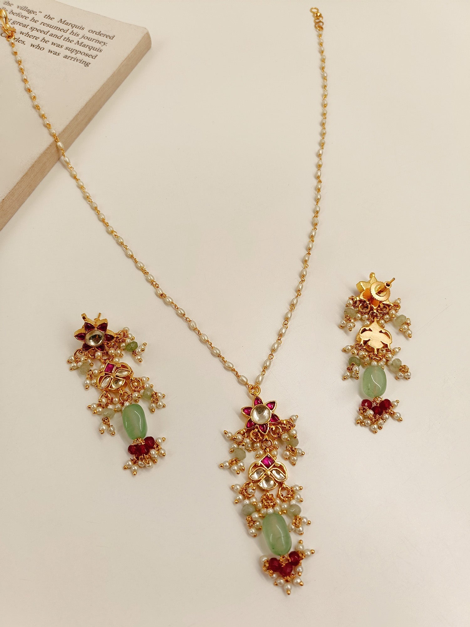 Elegant Kundan Pendant Set with Detailed Craftsmanship and Gold Ball Hanging