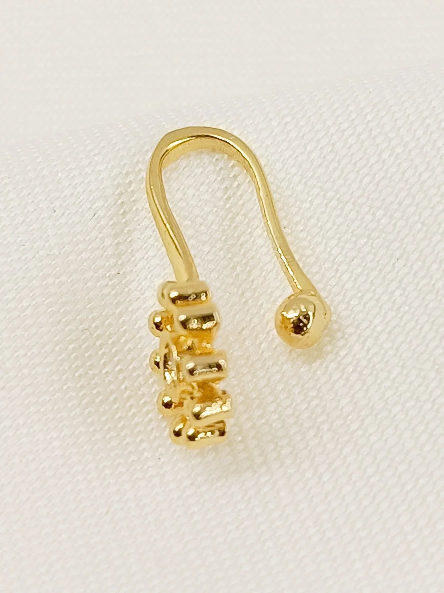 Lakshita Golden American Diamond Pressing Nath