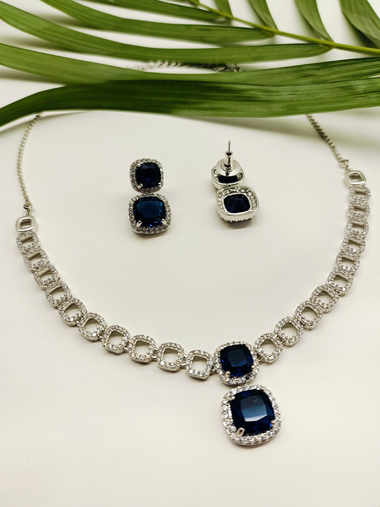 Gurleen Navy Blue American Diamond Set, a chic and sophisticated combination of necklace and earrings, perfect for elevating any outfit