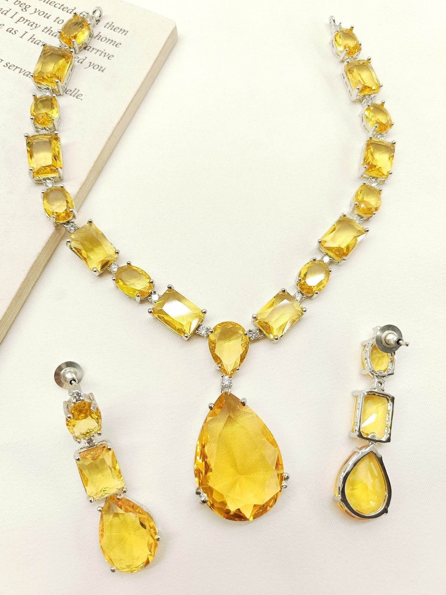 Elegant Swarovski stone necklace set with yellow stones and silver metal
