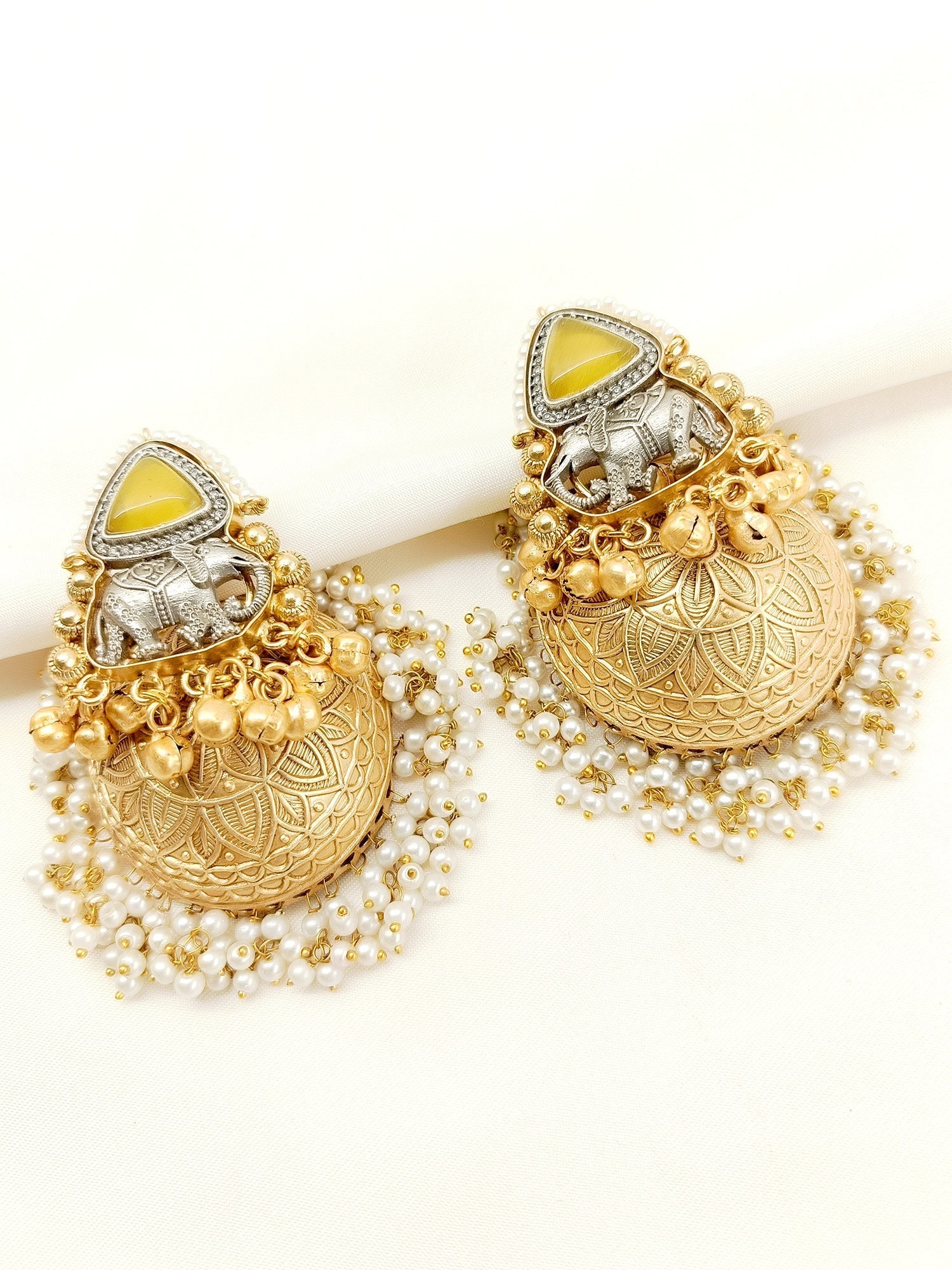 Gold plated brass metal jhumki with traditional designs and pearl hangings