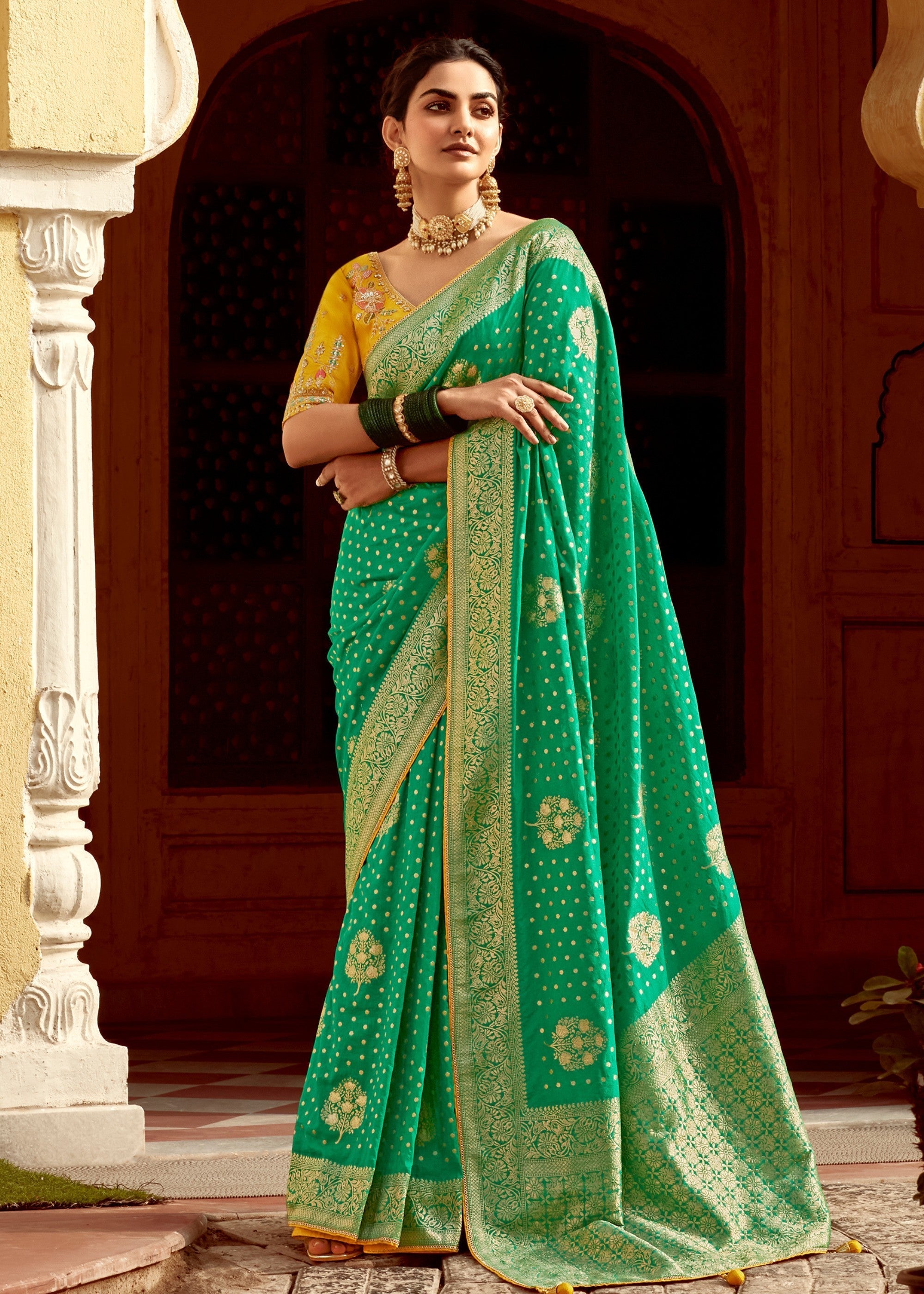 Emerald Green Dola Silk Saree Embellished With Weaving Work And Heavy Embroidered Blouse - qivii