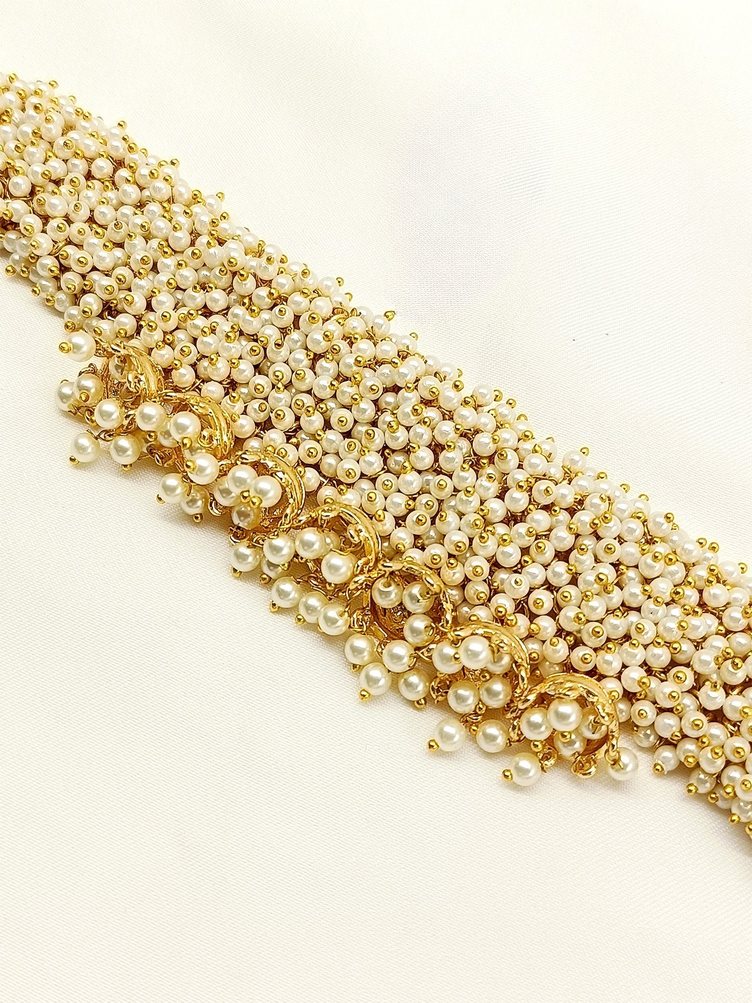 Elegant and timeless boutique neckpiece with gold plating and pearl detailing