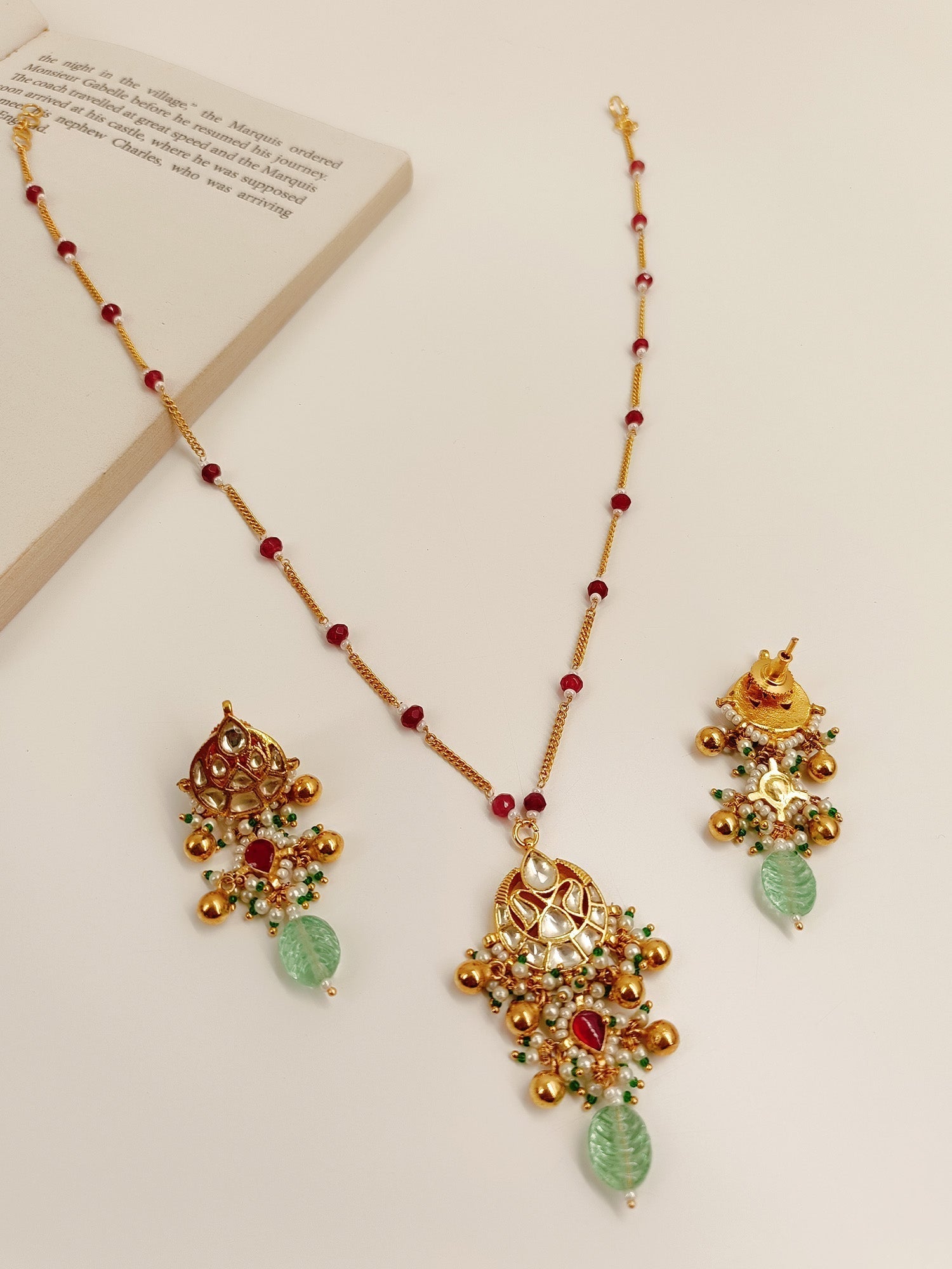 Traditional Kundan pendant set with detailed craftsmanship and elegant design
