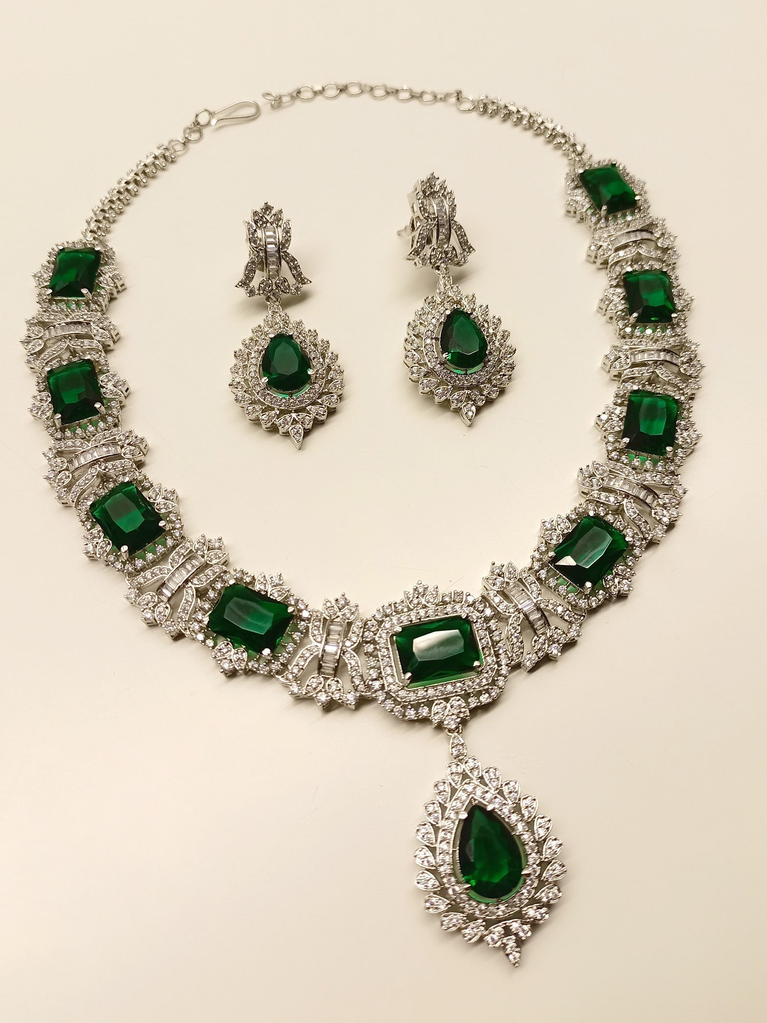 High-quality silver-plated brass metal necklace set with green American diamonds