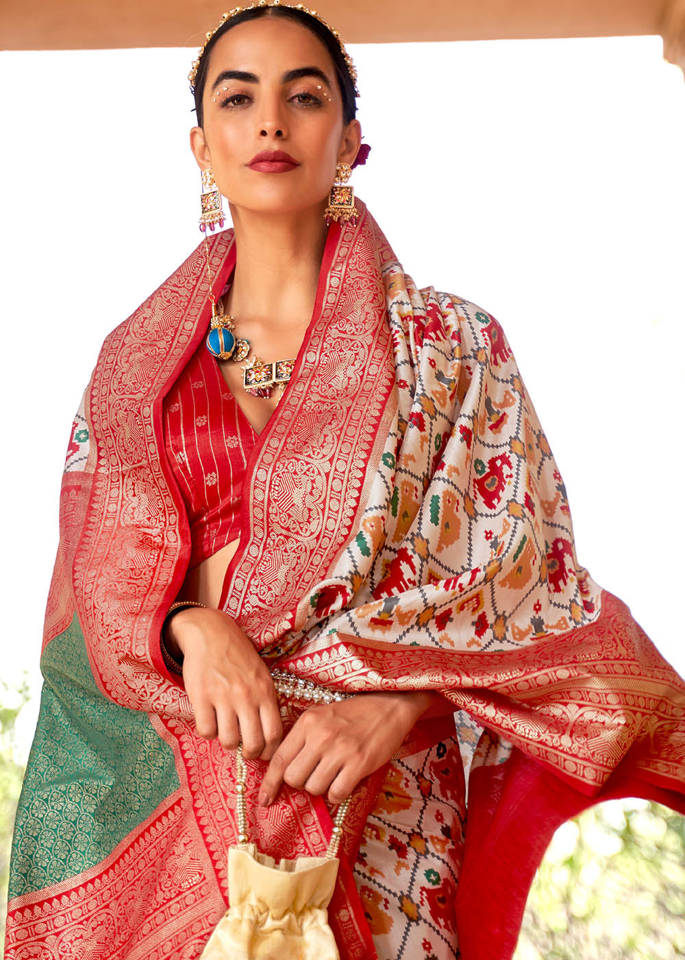 Pearl White Printed Patola Silk Saree with Zari Border & Tassels on Pallu - qivii
