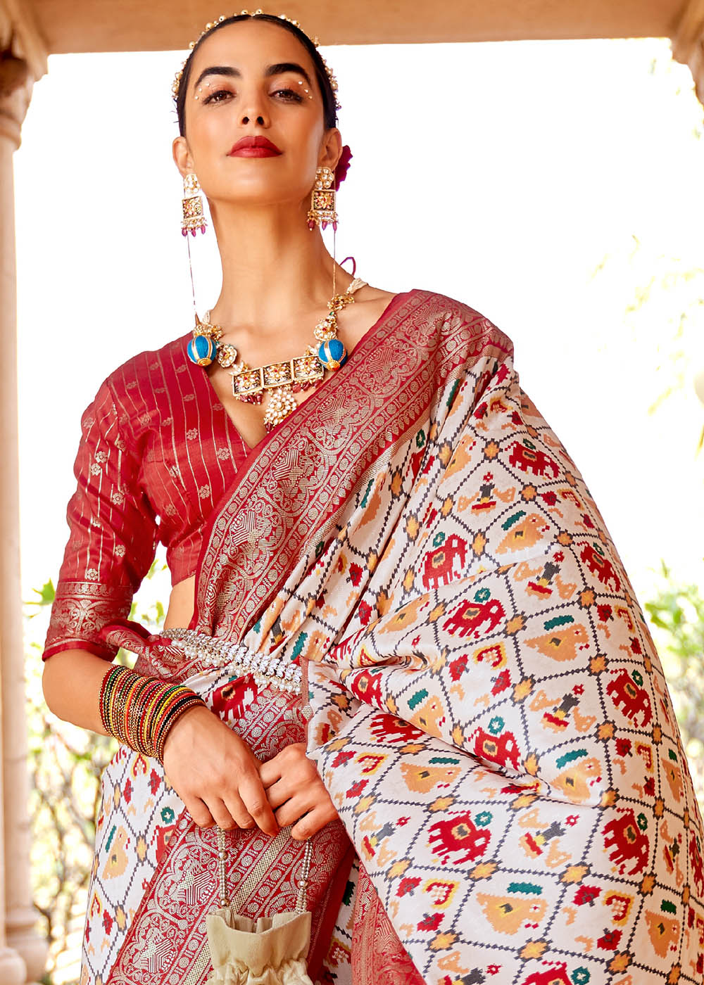 Pearl White Printed Patola Silk Saree with Zari Border & Tassels on Pallu - qivii