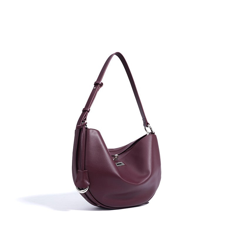 Women's Hush Rider Bucket — Genuine Leather Saddle Bag with Signature Lock Fastening & Convertible Shoulder Strap