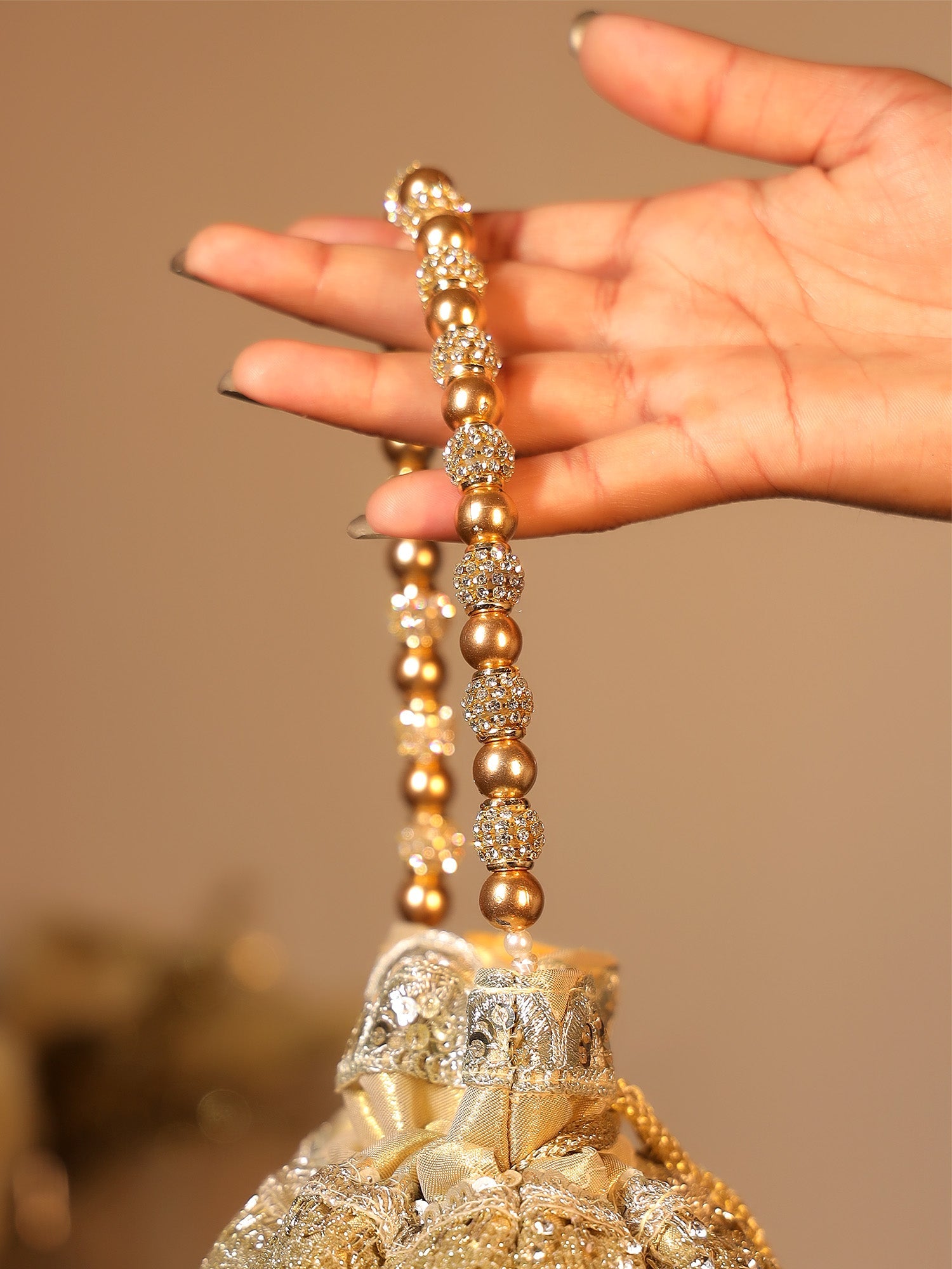 Elaya Copper Potli Bag - qivii