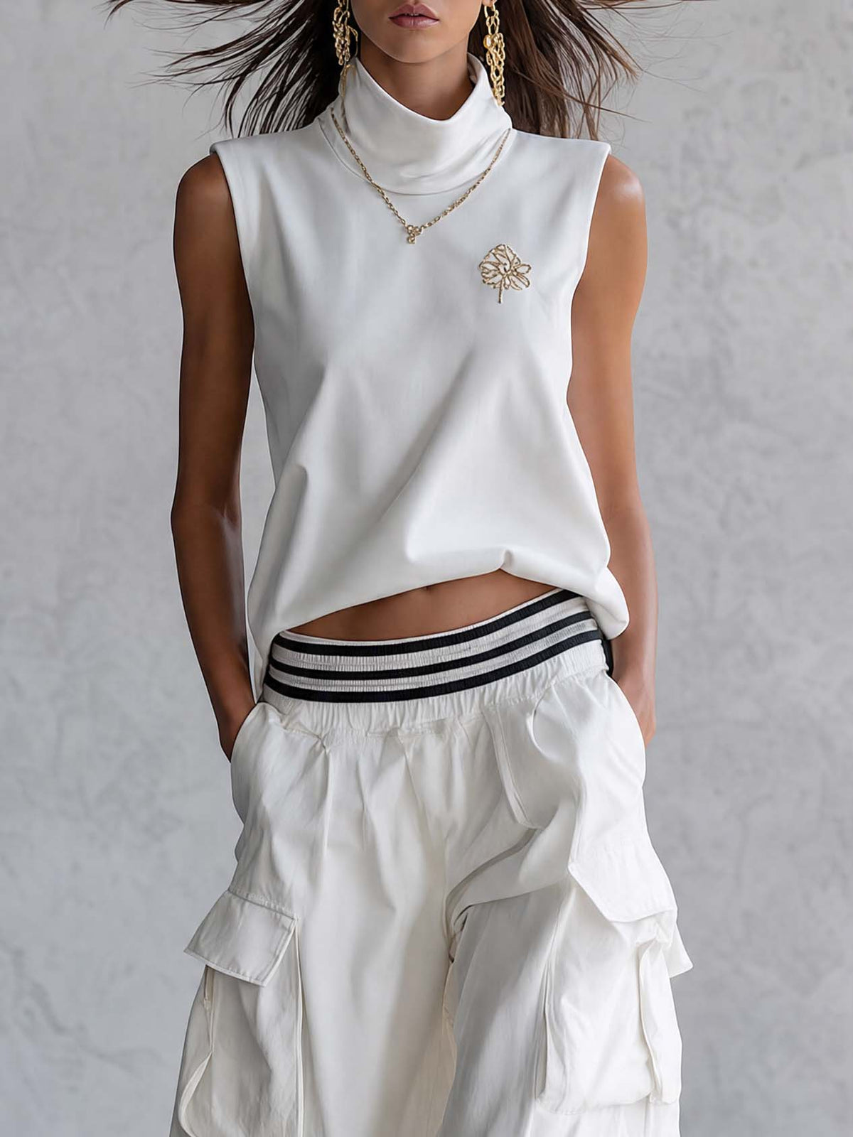 White cotton sleeveless athletic workwear top with mock neck and matching pants set by Oyrosy Clothing, women's fashion outfit.