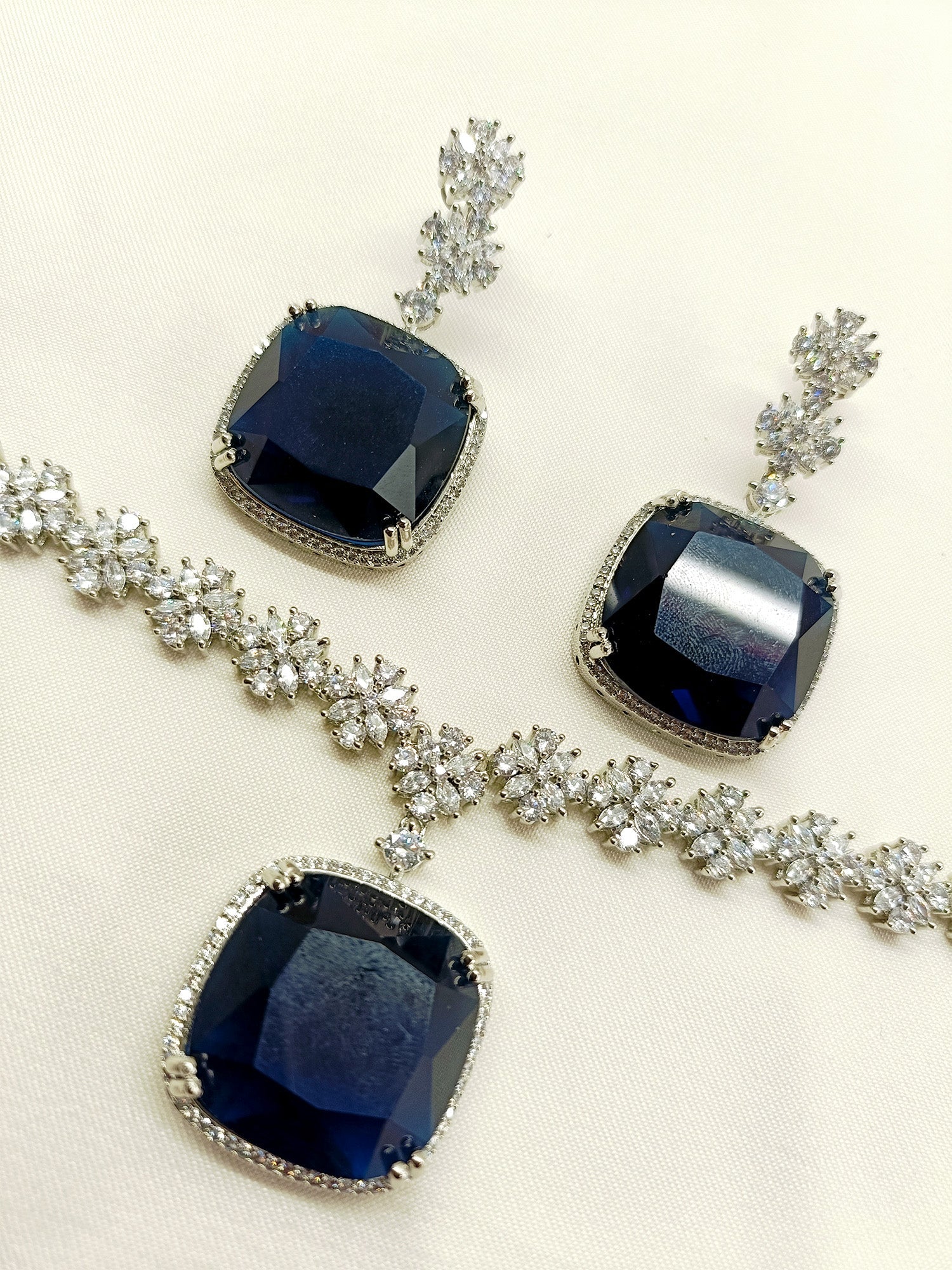 Beautifully crafted Jigya Navy Blue American Diamond Necklace Set, the perfect addition to any wardrobe
