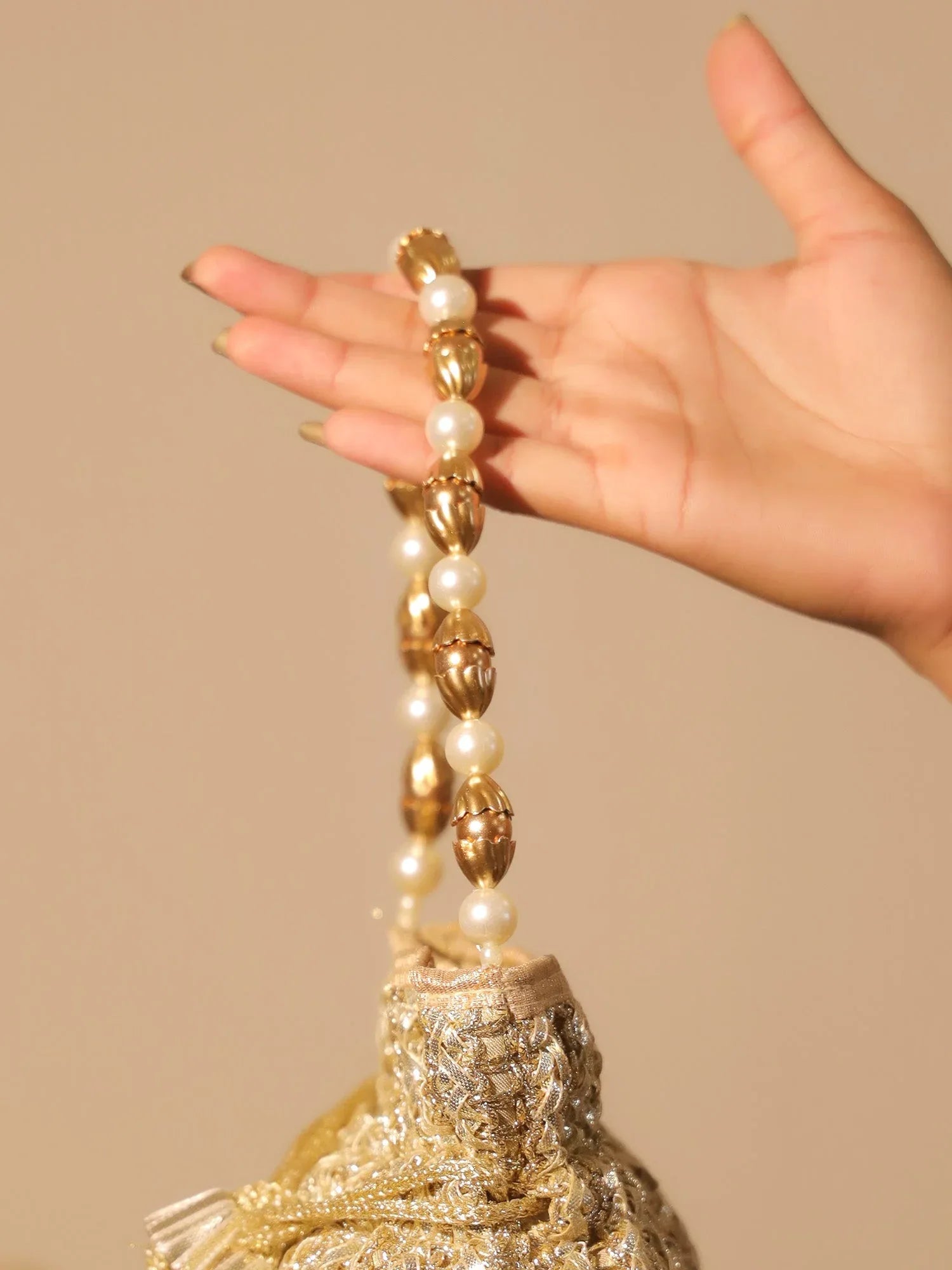 Naysa Golden Potli Bag