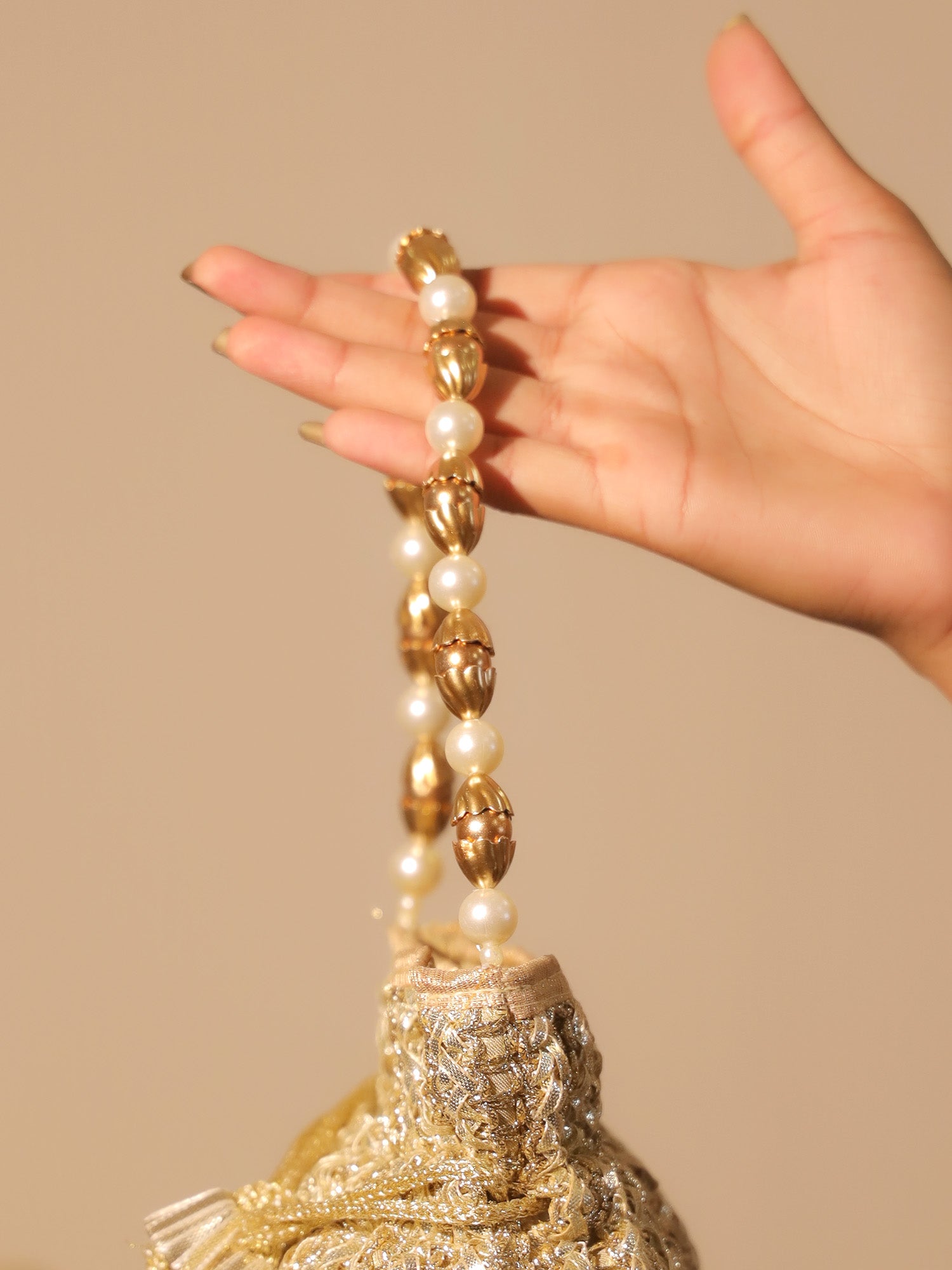 Naysa Golden Potli Bag - qivii