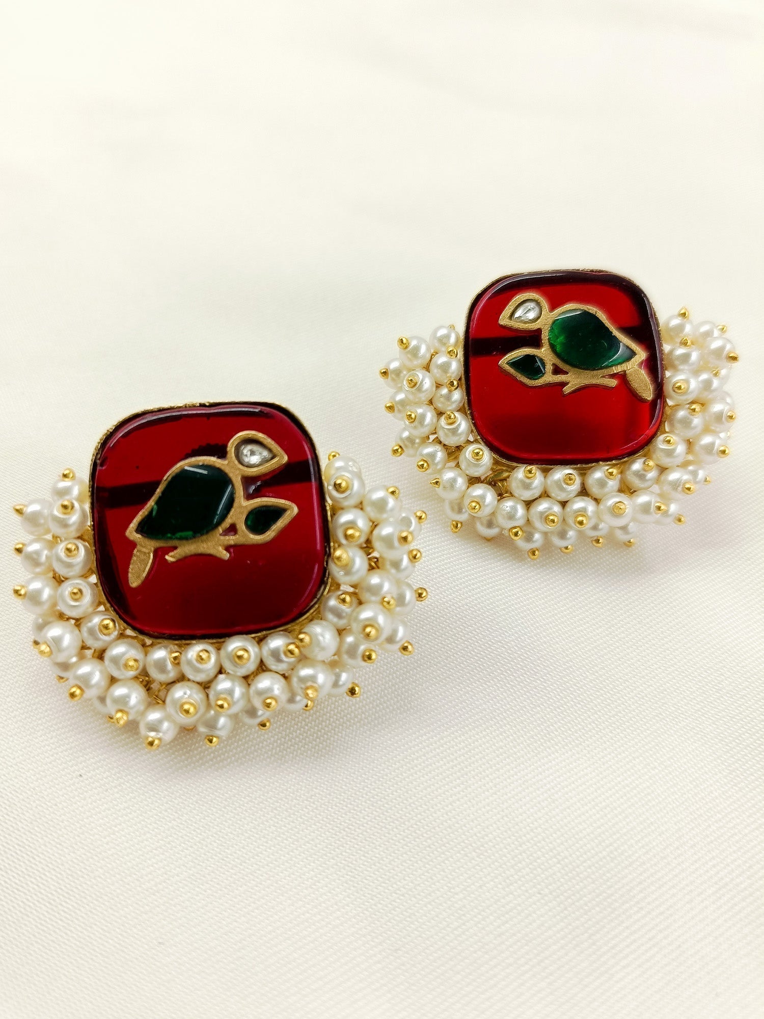 Elegant and stylish boutique top adorned with gold plated brass metal and pearl detailing