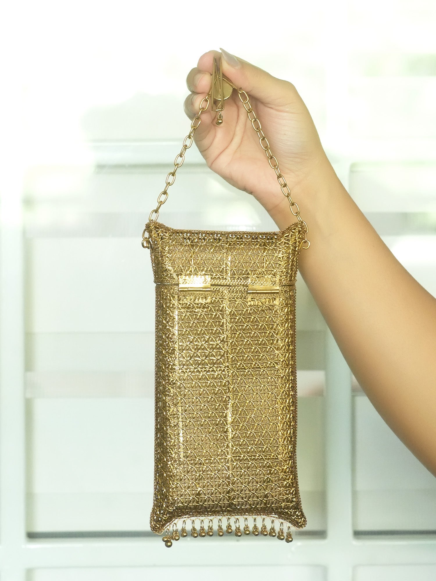 Saanvika Golden Mobile Pouch