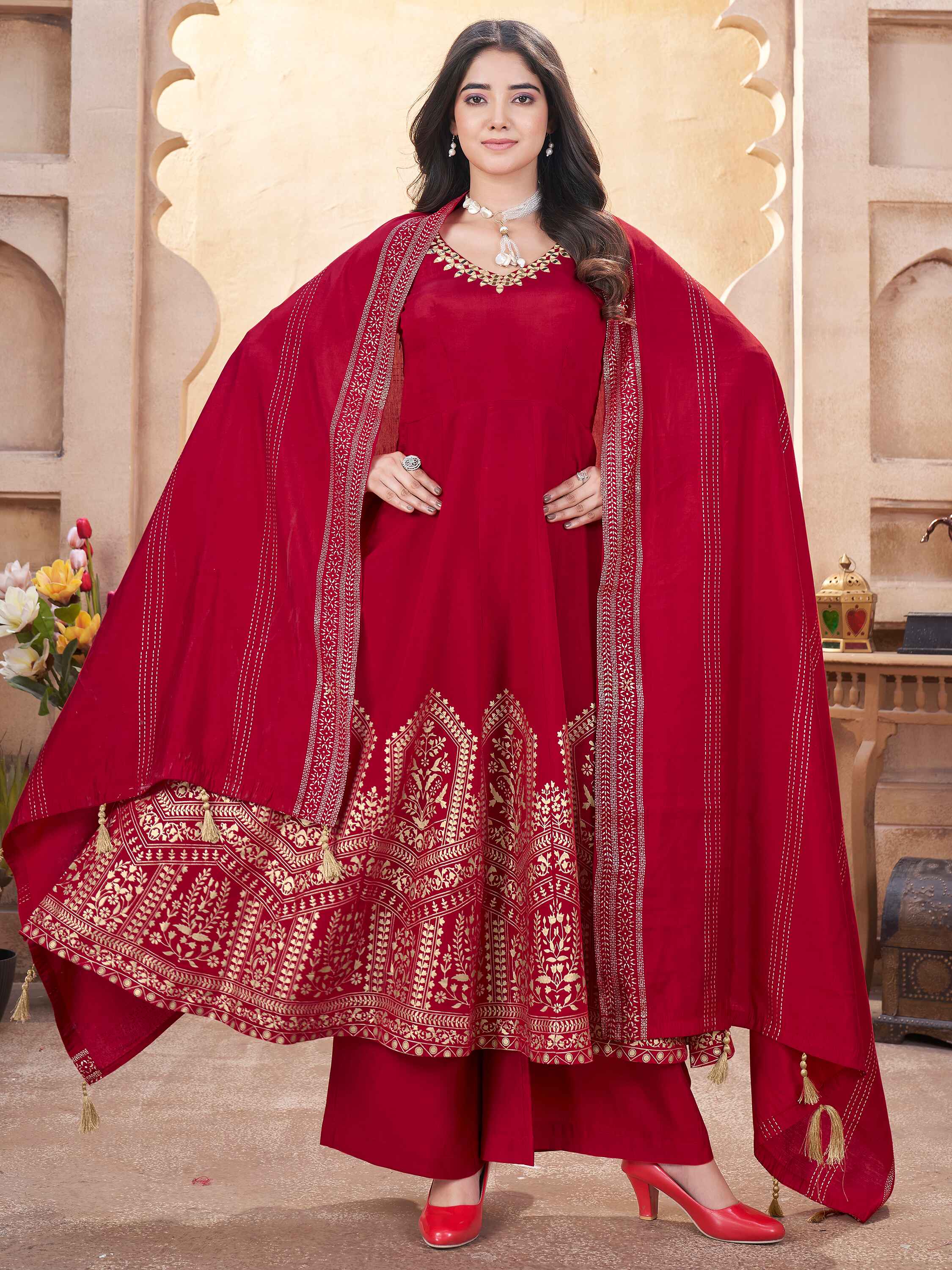 Exquisite red silk Anarkali suit with intricate foil print and mirror work