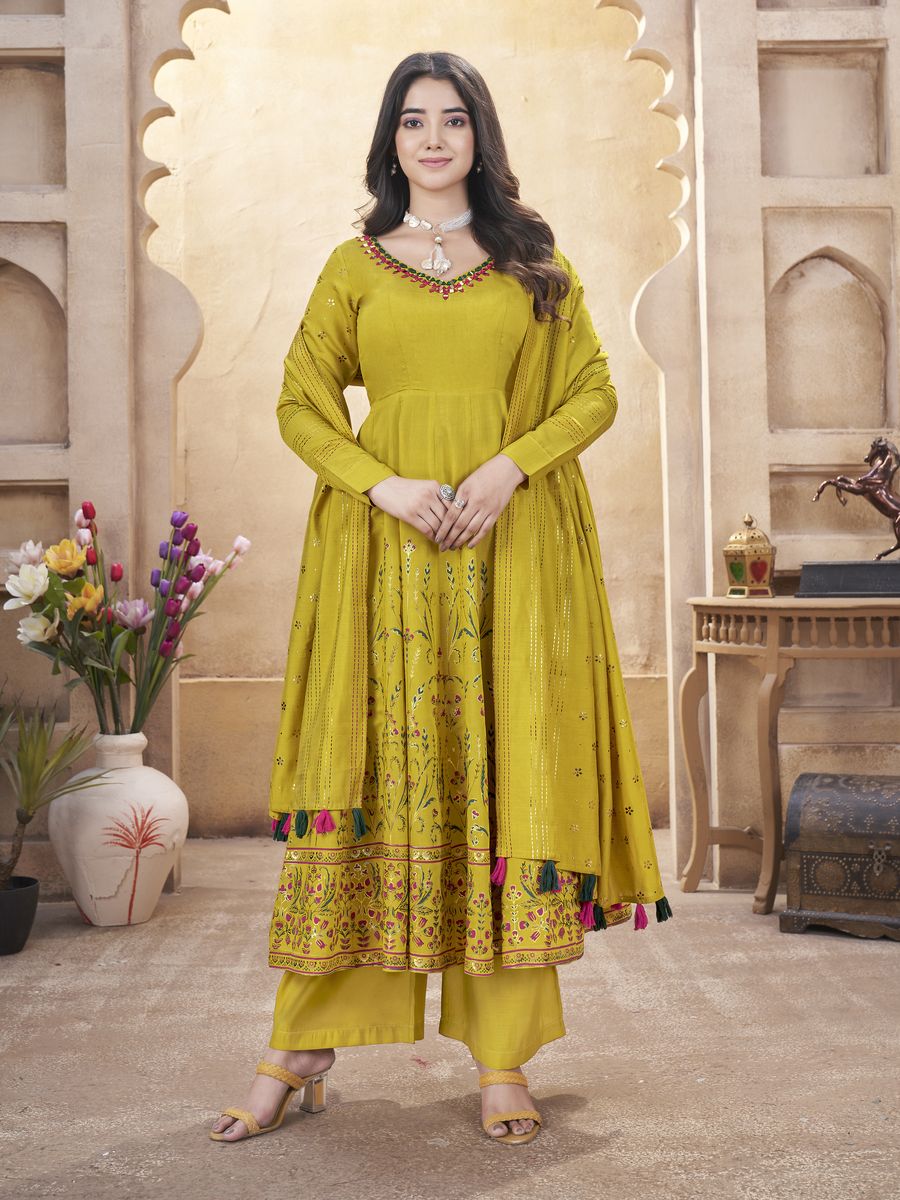 Yellow Roman silk mirror work and foil print salwar suit in size M-38 and XL-42 with top length of 50 inch and bottom length of 39 inch