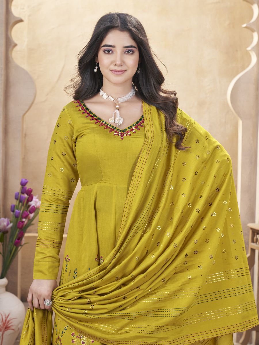 Elegant yellow Roman silk salwar suit with mirror work and foil print, comes with a 230 MTR dupatta