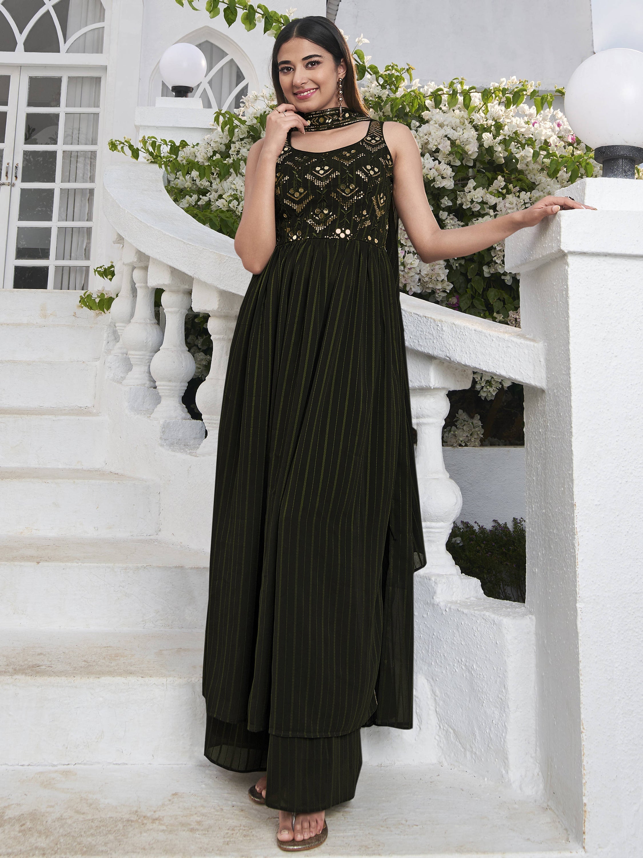 Embroidered green georgette salwar kameez with intricate detailing for weddings